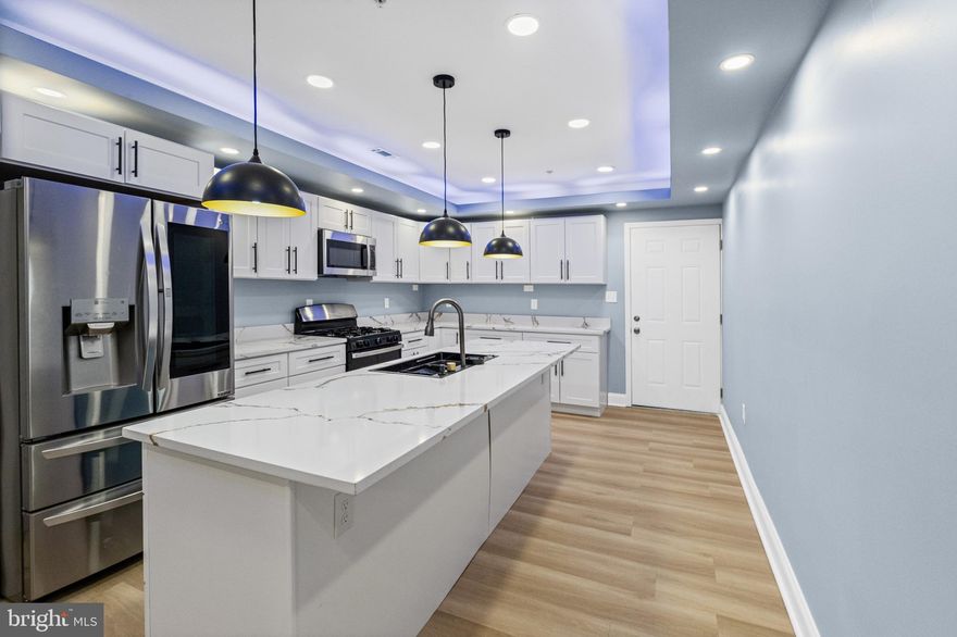 Discover the ultimate blend of luxury and style in this fully renovated end-of-row townhouse in Edmondson Village. This one-of-a-kind Baltimore City home is packed with features you simply won’t find anywhere else. Enjoy stunning electric fireplaces all throughout the home, televisions are included, and the convenience of a bathroom on every level. The open-concept living and dining space flows perfectly for entertaining, while the modern kitchen with premium appliances makes every meal feel elevated. With 3 spacious bedrooms, 3.5 luxurious bathrooms, and a fully finished basement ideal for a lounge, office, or entertainment space, this home was designed for comfort and sophistication. Step outside into your private backyard oasis featuring a built-in gazebo, perfect for relaxing, entertaining, or unwinding after a long day. Homes like this rarely hit the market in Baltimore City—there’s truly nothing else like it. Don’t miss your chance to own something special.