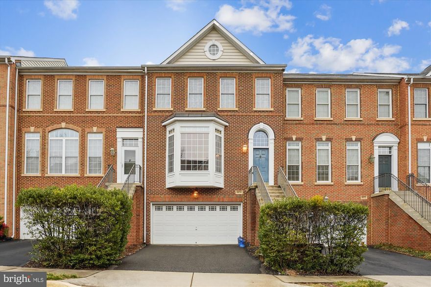 Luxury brick  3 bedroom, 3 1/2 bathroom townhome with 2 car garage in a fabulous location near the Vienna Metro! Enjoy a sun filled open floor plan with gleaming hardwood floors, adjoining dining area and sunroom. Primary bedroom features an en suite bathroom with a garden style separate tub/shower. Lower level with family room and gas fireplace.  Walkout to fully fenced back yard.
