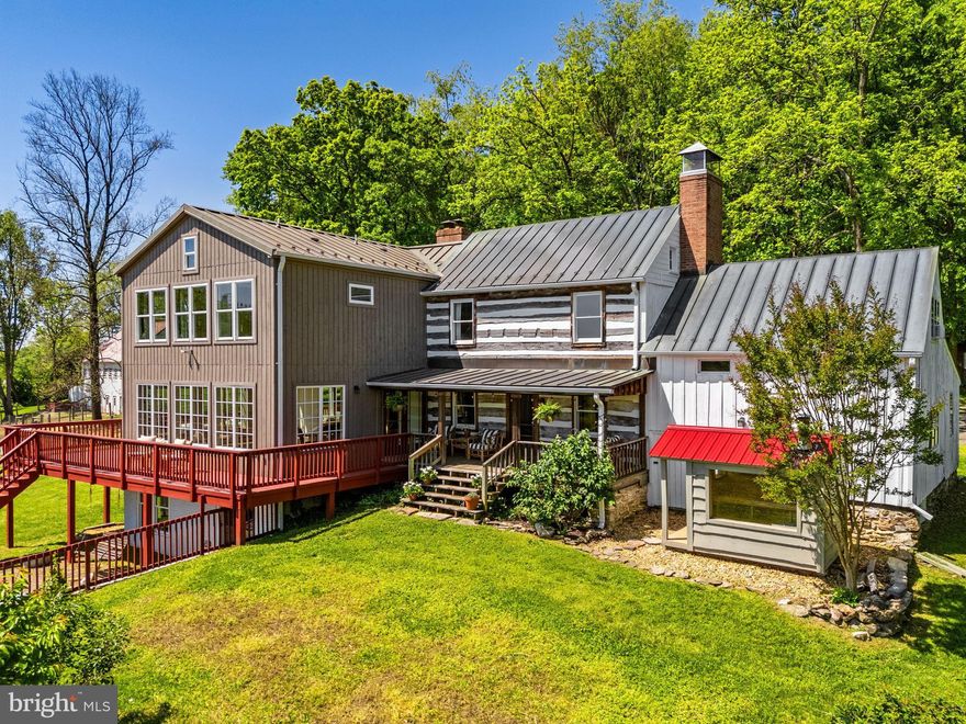 Extraordinary Historic estate  (updated!) on 30 breathtaking acres with VIEWS! Views that make you feel like you're in a tree house! Truly extraordinary property. No HOA and NOT in conservation. Stunning historic home and award-winning Fuog-built bank barn (2022).

Perched to capture spectacular eastern views, the property offers unforgettable sunrises and sweeping vistas stretching to Sugarloaf Mountain. With origins dating back to circa 1820, the original log home has been thoughtfully restored and expanded over time—creating a perfect blend of coziness, character, and modern comfort.  Additions in the 1990s and a stunning 2020 expansion have created a truly move-in ready home that honors its history while delivering today’s lifestyle. From the expansive wraparound deck, family room, and primary suite, you’ll feel immersed in nature—like living in a private treehouse retreat.

The main residence features 5 bedrooms and 3.5 baths, including a new 3-level addition. As part of the new addition, the luxurious primary suite boasts vaulted ceiling, stunning spa-like bath, and walk-in closet with convenient washer/dryer. The beautifully updated kitchen showcases custom cabinetry, a copper farmhouse sink, granite and butcher block counters, and opens seamlessly to a dramatic family/dining room with a wall of windows and wood-burning fireplace. Throughout the home, warmth and character abound with exposed log walls, beamed and vaulted ceilings, wood floors, and three fully functional fireplaces (all cleaned and inspected in 2025).

A charming and private in-law apartment, located in a wing of the original log home, offers exceptional flexibility, complete with its own entrance, kitchen, full bath, loft bedroom, and fireplace—ideal for guests, multigenerational living, or Airbnb potential. The walkout lower level adds even more versatility with a home office, gym, craft room, second laundry, and access to a brick patio with fire pit. Don't miss the private sauna where you relax and recharge while enjoying views of the property!

Outside, the land is as impressive as the home. A picturesque mix of open pasture, woods, and a spring-fed, stocked pond with dock and private beach creates a truly idyllic setting. Approximately 9 acres are fenced for livestock, complemented by electric fencing, three automatic waterers, and run-in sheds.

Equestrian and agricultural enthusiasts will appreciate the award-winning, Fuog-built bank barn (2022), designed for both function and beauty. This 2.5-level structure includes: 4 horse stalls; 6 sheep stalls with adjustable-height and removable walls; a milking station; pig pen with concrete floor and automatic waterer;  climate-controlled tack room; climate controlled feed room; flexible storage or event space which could be finished off to create four additional horse stalls; hay loft; wash stall with hot and cold water;  and equipment storage. Enjoy a turn-key working farm or an extraordinary party barn:)

With no HOA, the possibilities here are endless. Additional features include a copper roof (metal on addition), water treatment system, two water heaters (including tankless), wiring for a generator, and over $700,000 in recent improvements. Recent updates include: 3-level addition (2020), new bank barn (2022),  HVAC (2018), tankless hot water heater (2019), newer boiler (2019), newer well pump, septic tank pumped (2025).

If you're looking for land, views, charm and freedom, this is the place for you! Don't miss this incredibly unique opportunity.