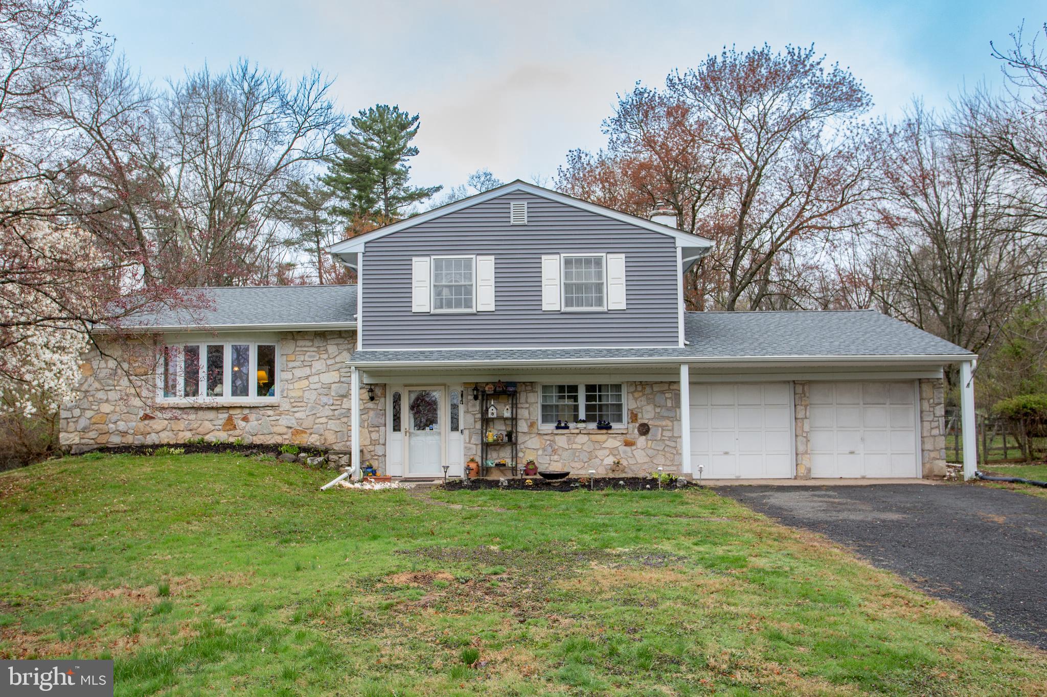 Charming Split-Level Colonial in the Desirable Central Bucks School District Nestled in the heart of New Britain Township, this lovely home offers the perfect blend of comfort and convenience. Enjoy easy access to the historic town of Doylestown, as well as nearby state and county parks and lakes. Lovingly decorated with the owner's personal touch, this home invites you to add your own style. Featuring hardwood floors throughout spacious living areas, it provides a welcoming atmosphere. With 3 bedrooms and 2 full baths, this home is perfect for everyday living. The first floor boasts a cozy family room, complete with a stone fireplace and a pellet insert, along with classic beamed ceilings. From here, sliding doors lead you to a private patio and expansive backyard—ideal for outdoor relaxation. For year-round enjoyment, a finished sunroom offers a bright, airy space. A full bathroom is also conveniently located on this level. On the main level, the bright and airy living room features large windows that flood the space with natural light. This area flows effortlessly into the dining room and eat-in kitchen, making it perfect for both everyday meals and entertaining. Upstairs, the third level offers 3 charming bedrooms. The main bedroom is enhanced by a private dressing area with its own sink, creating a peaceful retreat. Additionally, a walk-in hall closet and linen closet offer ample storage for all your belongings. Don’t miss out on the opportunity to see this beautiful home. Schedule a tour today!