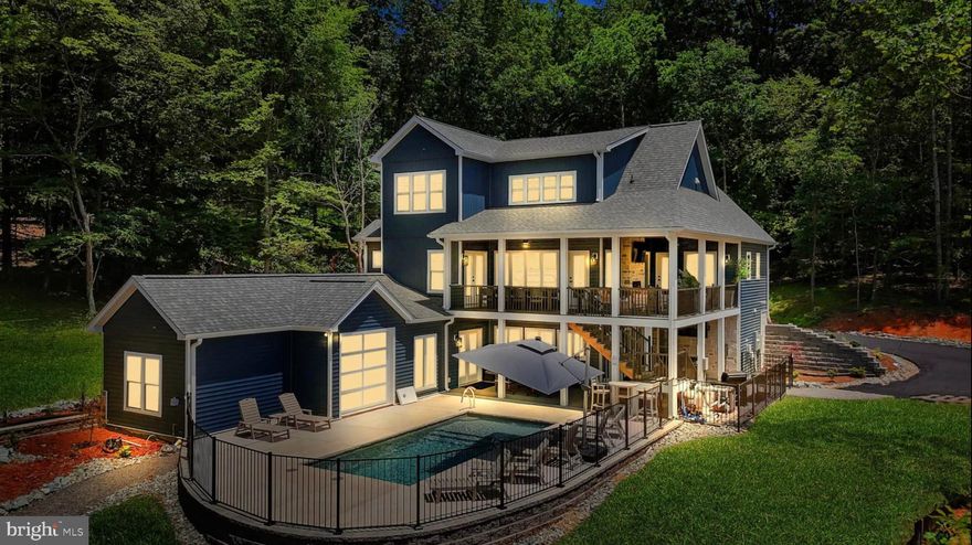 Welcome to this EXTRAORDINARY new construction on the BEST PART of Lake Anna! Perfectly positioned on the main lake with clean, clear water FAR from HAB zones, and a flat, easily accessible lot. Designed for both luxury living and high-performing investment potential, this waterfront retreat is set to gross over $350,000 annually in rental income. Every inch of this property is crafted to capture Lake Anna's natural beauty while offering unmatched modern comfort and convenience. The home features 9 spacious bedrooms and 6 full bathrooms, supported by an 8-bedroom septic system and a community-maintained offsite well.

The craftsman-inspired design flows throughout the open-concept interior, highlighted by vaulted shiplap ceilings, a gourmet kitchen with a farmhouse sink and custom vent hood, and direct access to a covered porch dining area ideal for gatherings. Each bathroom showcases full tile showers, including a luxurious master bath with a walk-in shower and a lake-view window. Outdoor living is where this home truly shines. Enjoy the heated saltwater pool with Omni Smart controls, or relax in the Hot Springs 8-person hot tub overlooking both the pool and shimmering lake. Through cascading glass doors, a poolside recreation room with a wet bar provides a seamless transition between indoor and outdoor spaces. The large dock, complete with an enclosed gathering area, invites endless waterfront entertainment and relaxation. Expansive covered porches with stone fireplaces, TVs, and cedar tongue-and-groove ceilings enhance the home's warm and inviting atmosphere. Smart home features, including smart thermostats, ensure convenience and energy efficiency throughout. This Blount Drive masterpiece combines timeless craftsmanship, resort-style amenities, and proven rental successoffering the ultimate opportunity to own a luxurious waterfront getaway on one of Lake Anna's most desirable stretches of shoreline! All information to be independently verified by buyer and buyer's agent.