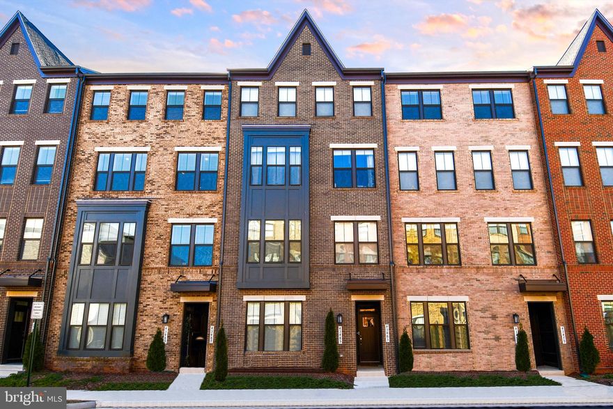 Stunning, Like-New 3-Bedroom Urban Townhome – Prime Location! 
This nearly brand new 3br, 2.5 bath, brick front townhome with a 1-car garage is a dream come true! Designed for modern living, it features a gourmet kitchen with stainless steel appliances, quartz countertops, and an oversized center island—perfect for entertaining.  Enjoy luxury vinyl plank flooring with a real wood feel, neutral white paint throughout, plush upgraded carpeting in the bedrooms, and elegant hardwood stairs. The owner’s suite boasts tray ceilings, a spa-like bath with a double-sized shower, dual vanities, and a spacious walk-in closet with built-ins.   With high ceilings, floor-to-ceiling windows, and an open, airy layout, natural light floods every corner.  The convenient and efficient modern electric fireplace,  big screen TV  and spectacular views, add to the ambiance of the living room, and the location is Unbeatable—just steps from the pool and community center, minutes to Metro, Route 267, top dining, entertainment, and great schools. What really sets this home apart - Unmatched parking and breathtaking views!  With extensive parking in both the front and rear, it stands well above the rest at Metro Walk.  
Don’t miss this incredible opportunity—schedule your showing today!