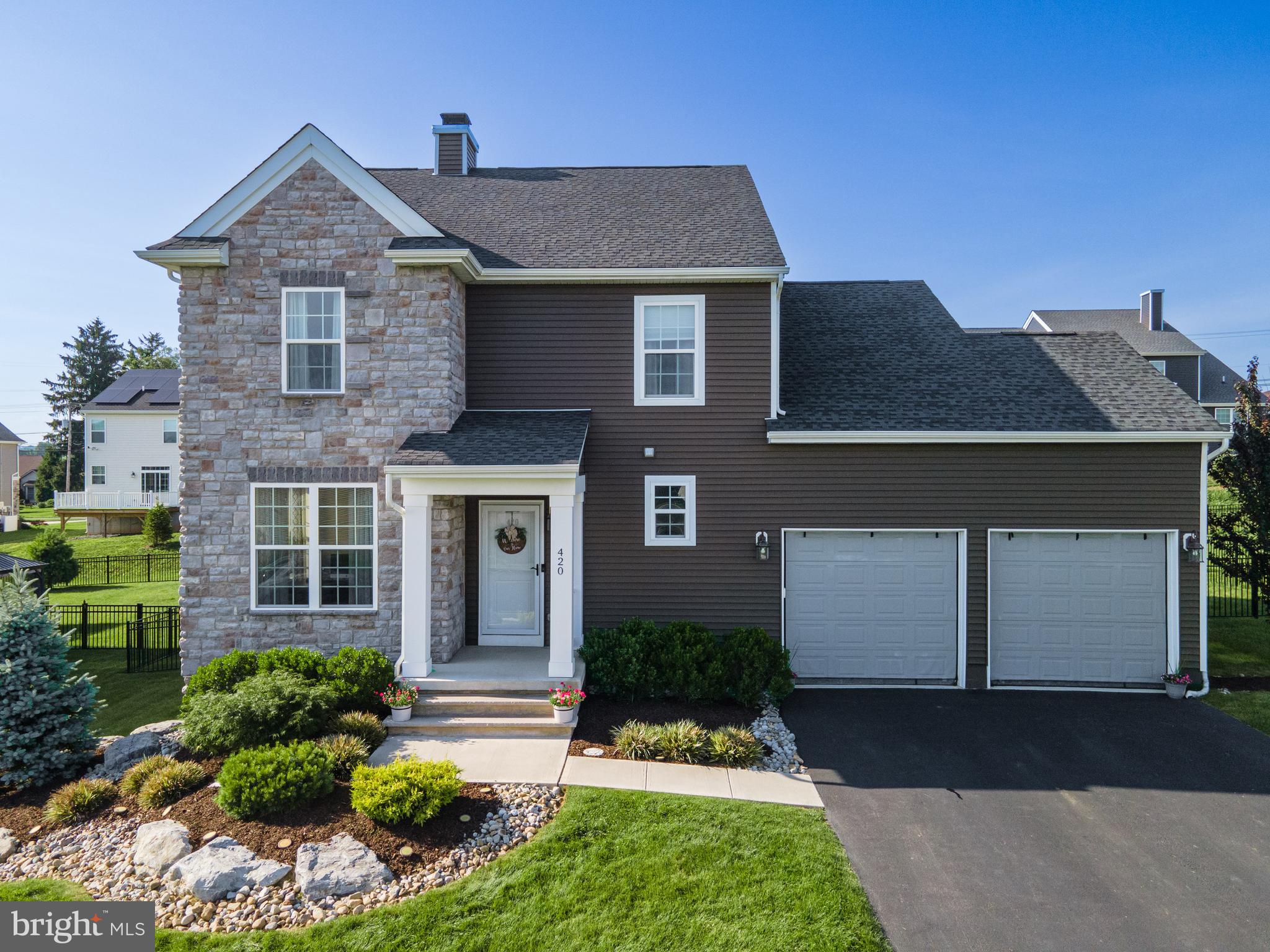 Showcasing classic curb appeal w/handsome stone-&-vinyl façade, manicured landscaping & a welcoming covered front porch, this 4-bed, 2.5-bath Colonial invites you through a ctr-hall foyer where rich HW flrs sweep across the main lvl. A sun-splashed den/office sets the tone for flexible living, while the FR—anchored by a wood burning fireplace w/custom built-ins & mantel—flows effortlessly to a stylish DR highlighted by an accent wall. The eat-in kitchen is a chef's dream, feat granite counters, subway-tile backsplash, stainless stl apps, under-cabinet lts & a ctr island w/pendant lts & bfast seating; sliding glass drs lead directly to the patio for easy indoor-outdoor gatherings. Upstairs, the primary ste boasts LVP flrs, a ceiling fan, walk-in closet & an indulgent spa bath w/2 sinks, tiled soaking tub, walk-in shower & private commode. 3 add'l carpeted bedrms—w/ceiling fans—share a full hall bath, while a laundry rm w/butcher-block counter keeps chores convenient. The fully finished basement expands the living space w/LVP flrs, recessed lts, a LG rec area & a separate exercise rm. Outside, enjoy summer BBQs on the paver-stone patio as little ones play on the swing set in the fully fenced yard. A 2-car garage & paved driveway round out the property—offering lots of room for vehicles, storage & hobbies—making this home the perfect blend of style, comfort & practical convenience. Close to US-22, PA-33 & I-78 for easy commute, Riverview Country Club, shops, restaurants & more!