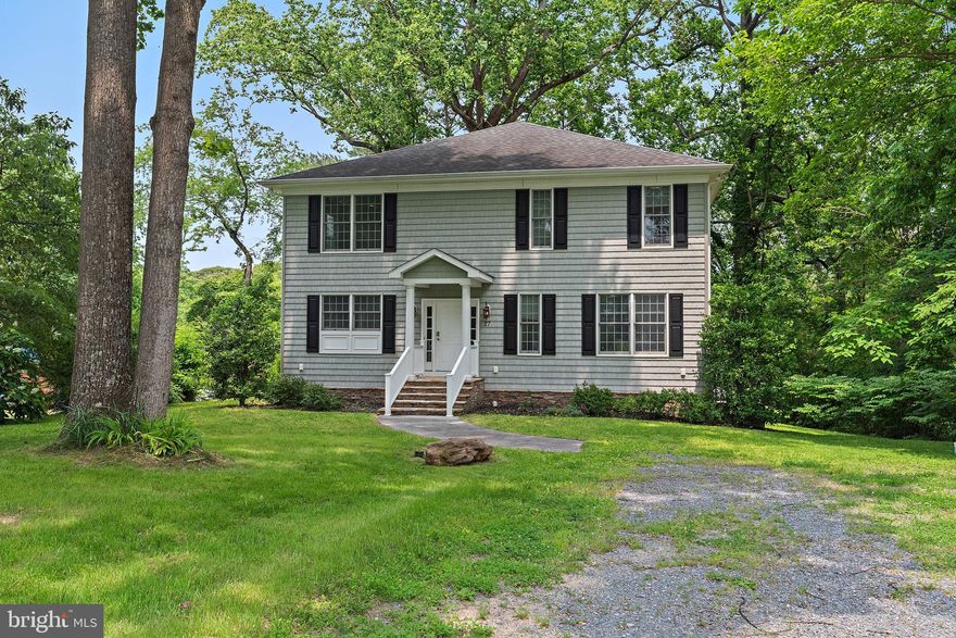 Have all the waterfront benefits without the waterfront price, this spacious Colonial home offers over 3,000 Sq. Ft. of living space and stunning water views of Cattail Creek. Enjoy the convenience of keeping your boat and kayaks etc.  at the community beach directly in front of your house (limited availability, subject to a waiting list). This 2009 built home features 9-foot ceilings throughout, creating an open and airy feel. The main level includes a bedroom with an adjoining full bath for multigenerational living , in-laws limited mobility etc., while the upstairs boasts a massive master suite with luxurious bath w/ double vanities, a Jacuzzi tub, and a separate shower, large walk in closet. The other two bedrooms share a Jack-and-Jill bathroom.  The hidden gem  is perfectly designed for entertaining, with huge rooms throughout, and a brand-new 40x16 deck overlooking a private, serene setting. Large deep basement with walkout and full windows just waiting for your finishes. You’ll also be close to a small community playground, clubhouse, and a boat ramp, community pier with slips, all located along the beautiful Magothy River. This home is located in a fantastic area with walking distance to Folger McKinsey Elementary &  Severna Park Schools, making it a prime location for all activities, boating, shopping, restaurants, gyms, pools etc.