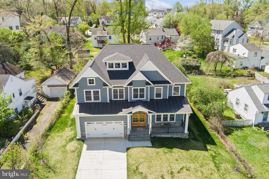 Price Reduction! NEW PHOTOS, STAGED. BEAUTIFUL NEW HOME near Tysons and Cap One. 10' ceilings on main and upper levels;  recessed lighting and hardwood floors throughout.  Open floor plan includes gourmet kitchen with eat-in area,  island, walk-in pantry, butler's pantry, and family room with gas fireplace. Large dining room and living room.  Beautiful wood door with beveled glass opens onto bright, two-story foyer.  A first floor guest suite contains a bedroom and private bath.  Two-car garage opens into large mudroom with tile flooring.  Four bedroom suites can be found on the second level, including the substantial primary bedroom with tray ceilings and private balcony, two walk-in closets, bathroom with two sinks, soaking tub, and very large shower.  Each bedroom has its own bathroom.  A laundry room with hook ups, counter, sink, and access to the attic can also be found on the second floor along with a loft area perfect for a crafts room, kids study/play area, upstairs family room, office, or exercise area that overlooks the foyer.  Two more bedrooms with a Jack and Jill bathroom, rec room with outside access, wet bar, and half bath can be found on the lower level along with another set of hook ups for a second laundry room.  The house is elegant, the floor plan great for entertaining or just relaxing at home, and the location is spectacular: close to Tysons, I-495, Cap One Center, schools, and not far from Metro.  You have to see it to believe it!