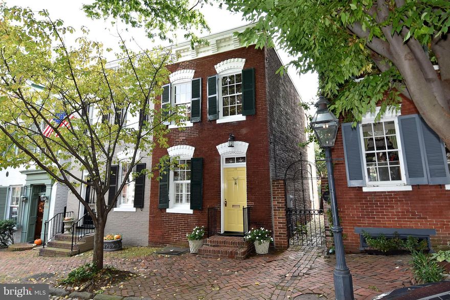 Heart of SE Quadrant. Filled with character & light,  renovated end townhouse has recent gas boiler for desirable radiator heat; gas water heater; roof  relined chimney; heart pine kitchen floor, gas range, dishwasher Extensive built-ins, high ceilings, wainscoting, period details.  Brick walled patio with garden shed, seating & dining areas. Block to Potomac River & King St