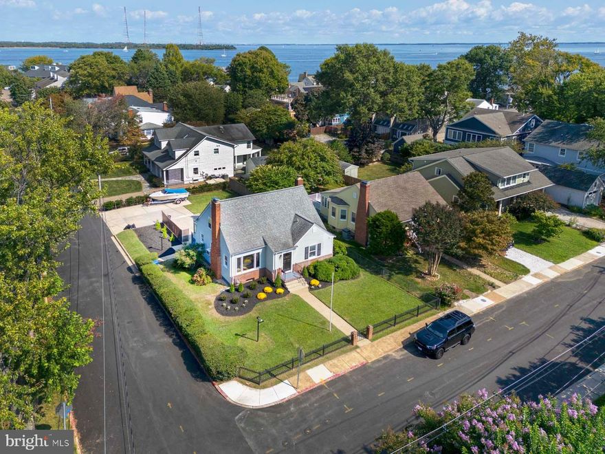 Offers Due Saturday 9/28 by 2pm.

Rare Find A Classic Eastport cottage located near the end of the Eastport Peninsula.  Spectacular large corner lot  with a parking pad that can accommodate up to 4 vehicles and one block to the Chesapeake Bay.  Wake up to a bright sun filled home, loved by one family from 1959 to present.  The iron gate surrounding the front yard is part of the original fencing from  Saint Mary's  and the brick fireplace in the lower level contains bricks from all over Downtown Annapolis historic places.  Located just minutes on foot are parks on the water for relaxing, taking your dog swimming or launching a kayak for a day out on the water.  Eastport Yacht Club and many other Marinas are on the peninsula for docking your boat as well restaurants from fine dining to casual and shopping as well.  Resort Style Living.  Rarely will you find a lot this large on the Peninsula and a corner lot to boot with parking.  The lower level features a walkout,  knotty pine walls, a wood burning brick fireplace, half bath, bar and work shop area.  The main level has a large picture window in the living room with a brick wood burning fireplace, hardwood yellow and white oak floors original to the home and a large room off the kitchen and living room for dining or a family room.  Main floor also has two bedrooms and a full bath.  The entire upper level is the third bedroom, and features loads of storage and could easily be designed into a stunning primary suite.   Floors on the upper level are same yellow and white oak floors original to the home.   No need to vacation living here with so many outstanding amenities so near you.  Auxiliary Dwelling Units are very popular and this lot would be ideal for one please refer to the rules and regulations for ADU's.  In the summer and fall take the water taxi to downtown Annapolis from the Chart House at the end of Second Street or at the opposite end of second street you have the seafood market and Maritime Museum. There are few opportunities left to find a home like this on larger corner lot that has parking don't miss your chance to make this your dream home.