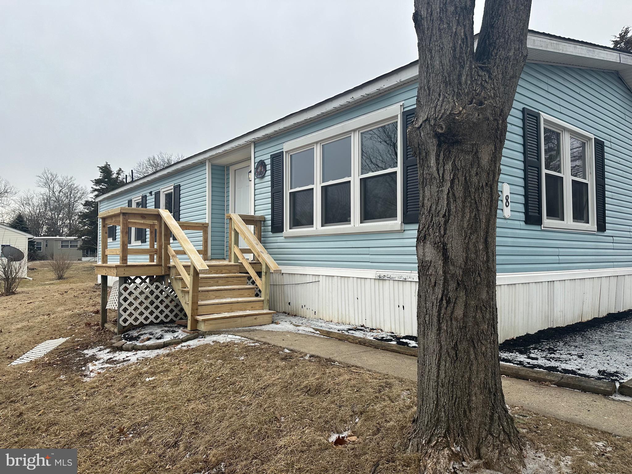 If you are looking for a "wow" factor you have found it in this remodeled ,redesigned home. The bright living, dining, and kitchen areas have been totally rebuilt with new appliances, quartz countertops and new flooring throughout. The island allows extra seating . There is a new heat pump . The bedrooms are a generous size and the laundry room can have several uses. There is a sliding glass door that opens to a large rebuilt deck perfect for warmer weather entertaining. The land lease includes some water/sewer use, pool, mini golf, chip and putt, fishing ponds ,and the use of the community hall for private functions. Park approval required.