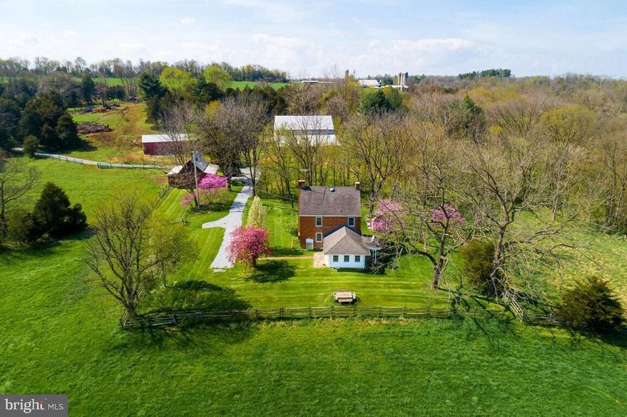 In the heart of historic Washington County, back a long tree lined gravel lane, you will find the most secluded and private 1840's federal style home and peaceful farmette.  While literally living so serene in an untouched Bob Ross painting, you will enjoy the quiet - peaceful mature trees and incredibly maintained grounds with the highlight of a healthy year-round running Antietam Creek.  Drop in for a float, enjoy a paddle or have canoes and kayaks ready to go - the water is wide and the access is so easy.  Friends have camped along its banks many a weekend!  Antietam National Battlefield, the Appalachian Trail, Crystal Grottoes Caverns, The field hospital museum and the C and O canal are all incredible activities within minutes of this unique and special homestead.  Mature trees and breathtaking views surround the estate and inside, you will enjoy the 2022 additions of solar powered energy, leaf fitter gutter guard systems and whole house efficient air conditioning and heating systems.  Sellers have updated the fireplace in the FR and it's plumbed for your selection of a gas log fireplace log set.  Graceful charm resonates in the original 1800's skeleton key hardware, gorgeous hand hewn log beams and stunning floors throughout - slate and hardwoods. Incredibly peaceful elegance balance the state of indoor peace and outdoor activity here at 18712 Keedysville.  What once was a useful Summer kitchen is now a tucked away enclave of remnants creating a natural gathering spot.   The stone patio and outdoor fireplace offer the opportunity for additional peaceful moments either among friends or with a quiet cup of coffee or late evening glass of Washington county homegrown wine.  Speaking of wine, the owners are quite proud of their Concord grape vines and fruit producing trees.  The ample sized livestock barn could easily be used as a party barn or whatever your heart's desire may be.  The fully updated workshop leaves plenty of room for mechanics and craftsmanship projects with electricity and water readily available in the barn.  This quiet escape is easily accessible to Baltimore and Washington, DC making it a perfect air b and b or quiet getaway.