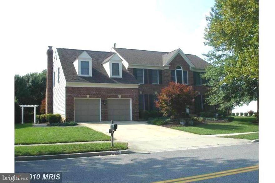 Simply stunning 3 level colonial. 4 (possibly 5) bdrms 3 f/ba & 1/hlf ba on mn lvl along w/spacious library, formal LR & DR, FR off kit w/wdfp. Gourmet kit w/granite countertops, island & family work station, 1st flr laundry center/mud rm off 2car garage. Custom window treatments & in-ground sprinkler system.  Professionally landscaped bk yard w/patio. Walk to tennis, swimming & tot lot