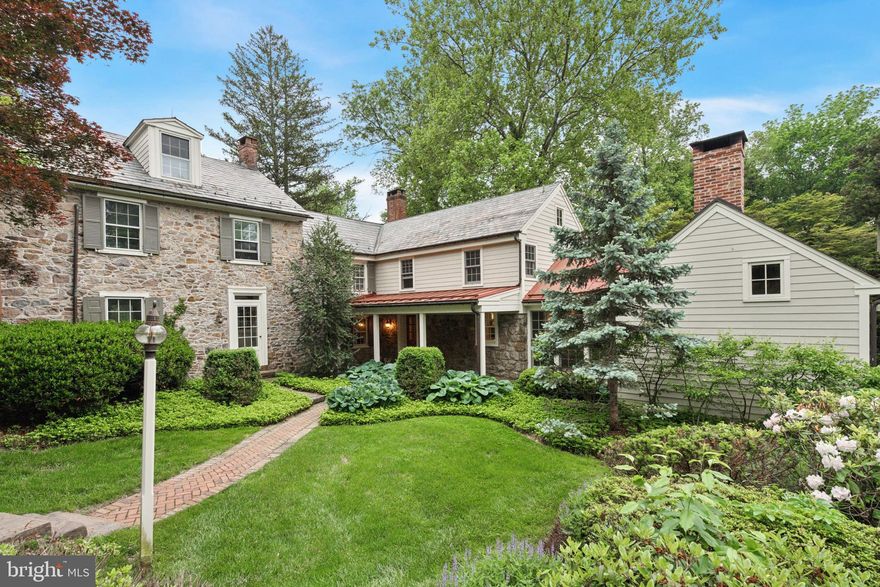 Welcome to 2320 Turk Road, a timeless Bucks County farmhouse estate. Nestled on a
sprawling lot set back from the road, this exceptional home is one of the most beautifully
restored historic properties in the region. Newly renovated, it offers complete privacy,
classic character, and turn-key luxury. The elegant 3-bedroom, 3.5-bath main(approximately 3,494 sq ft, 
the 2nd bedroom so large that you could put up a wall to form a fourth bedroom)  residence with pool is accompanied by a 2-bedroom carriage house(approximately 1,200 sq ft), original stone bank barn, and
picturesque spring house — all surrounded by rolling lawns and mature trees, creating a
tranquil country retreat on 4.7 Acres.

Dating to the late 18th /early 19th century, the main house masterfully balances preserved
heritage with modern comfort. Gorgeous wide-plank floors, three working wood-burning
fireplaces, and period details are paired with updated mechanicals, new central air, and
reinforced infrastructure for contemporary living.

Inside, you’ll find a gracious side entrance and mudroom, leading to a custom kitchen
that blends timeless style with functionality. Soapstone counters, high-end appliances
(Wolf, Sub-Zero, Fisher & Paykel), and a sunlit dining/lounge area are surrounded by
windows — including a newly installed picture window — that flood the space with
natural light and showcase panoramic views on all sides. Rustic ceiling beams and a
wood-burning fireplace add warmth and charm.

Adjacent rooms include a cozy formal dining room with a fireplace, an elegant entry foyer,
and a grand living room with traditional woodwork and a stone hearth.

The second floor features the primary and secondary bedrooms, a walk-in closet,
laundry, and two full baths — including a completely transformed primary bath offering a
spa-like experience. The third floor, fully renovated, has a bright, airy bedroom and en-
suite bathroom with handcrafted zellige tiles, creating a serene retreat.
Beyond the meticulous design and aesthetics, additional functional and mechanical
updates include new central air-conditioning, new roofing and repointed stonework. A new full-property generator services all three outbuildings, providing uninterrupted comfort and reliability.

The carriage house, a fully renovated 2-bedroom guest residence, features new skylights, HVAC/central air, updated electrical, a new hot water heater, and a new roof. Every detail — from the appliances to the finishes — has been upgraded, making it ideal for extended guests, caretakers, au pair quarters, or other flexible use. 

A newly sheet-rocked garage completes this versatile structure. The original two-level bank barn, currently used as a gym with additional large flex space, has a new boiler and repointed masonry to ensure its structural integrity —offering endless possibilities for a home office, studio, or retreat space.

Outdoors, the meticulously landscaped grounds include a newly fenced pool area and terrace, offering a peaceful setting for relaxation.  The wooded backyard, with a stream that could be turned into a natural pond, adds to the serenity. Over 60 large evergreen trees have been recently planted along the perimeter, ensuring privacy and a beautiful year-round natural border.

This is a rare opportunity to own a piece of Bucks County history, a bucolic sanctuary in the heart of Doylestown – just 78 minutes to Manhattan and under an hour to Philadelphia. More than a residence, this property is a warm and welcoming home steeped in history, offering classic elegance and modern luxury in one of the area’s most enchanting settings.