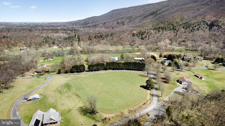 Discover the perfect spot for your dream home! This 3.102-acre lot in the desirable River of the Valley Subdivision offers breathtaking, unobstructed mountain views and access to the Shenandoah River. Completely cleared and ready to build, this prime property has a Cert letter for a 3 Bedroom conventional septic system. Located in Toms Brook, this lot provides the ideal blend of tranquility and convenience. Don’t miss this rare opportunity to own a river-access property with stunning scenery!