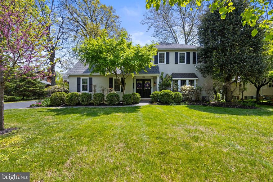 Set along a picturesque, tree-lined street, this exceptional Colonial is well worth the wait. Impeccably maintained and thoughtfully renovated, the home blends timeless elegance with modern comfort. A gracious living room with custom built-ins flows seamlessly into a sophisticated dining room, where French doors open to a serene screened-in porch—an ideal retreat for quiet afternoons.
The chef’s kitchen is both stylish and functional, featuring a generous island, Wolf range, expansive pantry, and built-in banquette. Sunlight pours through the windows, illuminating the space and offering tranquil views of the beautifully landscaped backyard. The adjoining family room is warm and inviting, complete with a gas fireplace, custom millwork, and surround sound. A spacious mudroom with laundry and ample storage completes the first level.Upstairs, the primary suite offers a private sanctuary with a custom bath  with heated floors and an expansive walk-in closet. Four additional bedrooms and two well-appointed baths provide flexibility for family and guests alike. Located in the highly sought-after North Wayne neighborhood, this home offers effortless access to parks, downtown Wayne, and the R-5 train. Residents enjoy a vibrant community lifestyle, highlighted by cherished traditions such as the progressive dinner, festive Halloween celebrations, and the iconic Soap Box Derby.  Square footage in floor plans are estimate.