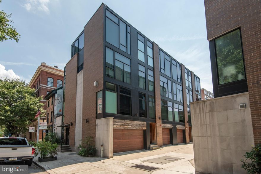5 YEAR TAX ABATEMENT! Located in the heart of OLD CITY, this beautiful 4-bedroom, 3.5-bath home is an end unit set back on a PRIVATE DRIVEWAY. Situated just steps from galleries, cafes, dog parks, historic monuments, this modern home which was completely customized during construction has classic finishes that will fit everyone's taste: designer kitchen with 10-foot CARRARA MARBLE island; soft close SIEMATIC custom shaker cabinets; 6-BURNER gas BERTAZZONI oven; gas FIREPLACE; GARAGE; gorgeous en-suite master bathroom with his/hers sinks, 3 shower heads, and RIVERSTONE detailing; hand-scraped floating stairs to match the long-plank, extra wide HARDWOOD floors; TWO DECKS with gas line for easy grilling; WALK-IN closets; FULL BASEMENT - unfinished with egress so the basement can be customized to your wants; 24-hour SECURITY system; VIDEO intercom; SMART HOME DUAL ZONE HVAC; LUTRON smart home lighting; third-floor LAUNDRY ROOM. All photos shown with king-size beds. Low HOA fees: HOA manages trash, exterior repairs, driveway. etc. Very friendly community will make you feel welcome the minute you move in! Also included with this property, only with an acceptable offer, is 1 year pre-paid parking at a parking lot nearby, which will be credited to the buyer at settlement,