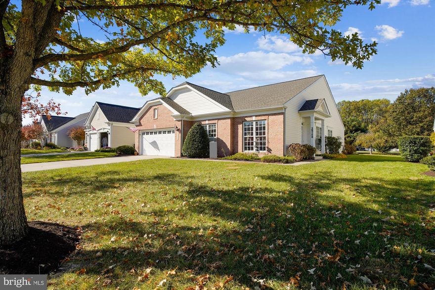 REDUCED by $34,500! Put the savings toward new flooring and paint to freshen up this cherished family's home and make it yours! If you're seeking the perfect place to spend your retirement years, look no further than this charming brick-front Vanderbilt model home with split bedroom design for privacy located in the highly sought-after Easton Club East - Active 55+ Community. Offering 2,184 sq. ft. of comfortable one-level living, this home is situated on a premium lot that backs to a tranquil, expansive parcel—part of the original farm that was subdivided to create this wonderful community.

As you enter the foyer, you're greeted by gleaming hardwood floors and a spacious, open-concept formal living and dining area. Off the main entry, you'll find a cozy library, plus an additional bedroom with an attached full bath, perfect for guests or as a home office.

The rear of the home features a comfortable family room with a gas fireplace and kitchen oversized breakfast room with tons of natural light—all with beautiful hardwood flooring. A sliding glass door off the breakfast area leads to a private patio with an electric awning, the perfect spot for enjoying the outdoors.

The primary suite is tucked away for privacy and overlooks the peaceful backyard. The primary bath offers plenty of space and natural light. The convenient laundry room leads to the front-entry 2-car garage, which provides abundant storage space and includes an extra fridge.

Additional highlights include a lawn irrigation system, a new roof (2021), and a recently replaced outside A/C unit (2023), ensuring your home is as comfortable and low-maintenance as possible.

Enjoy community amenities, including a clubhouse with an exercise room, library, entertainment area, outdoor pool, tennis and pickleball courts, a putting green, and scenic walking trails that wind through beautiful ponds and green spaces.

Located just minutes from Easton and a short drive to the waterfront towns of St. Michaels and Oxford, Easton Club East offers easy access to shopping, dining, art galleries, and more. BWI Airport, Annapolis, and the MD/DE beaches are all within a convenient drive.

Don't miss your chance to call this stunning home yours. Make the move to Easton Club East today—you’ll be glad you did!