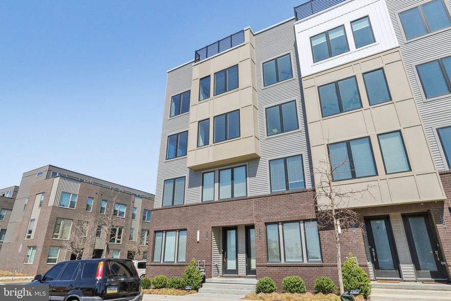 Welcome to this stunning newer construction condo in Northbank with breathtaking views of the river. The coveted Northbank community combines luxury living with unparalleled comfort. With direct access to Delaware ave, access to the i-95 ramps and walkability to Fishtown, this location is sought after. Situated along the scenic Delaware River, on a premium lot, this unit is flooded with natural sunlight and offers an open-concept floor plan perfect for both relaxing and entertaining. When you enter the unit, you have your landing/foyer area with access to your garage in the rear of the home. Head on up one flight of stairs and you’re greeted by a spacious living area with high ceilings, large windows, and sweeping views of the river and community that fill the space with warmth. The seamless flow between the living, dining, and kitchen areas creates an ideal space for hosting or enjoying quiet moments at home. You have a large center island with chef like kitchen which is great for those home cooked meals or laughing with guests over a bottle of wine. Your first floor offers multiple flex spaces from a den area perfect for your office to a little nook off the dining area that is perfectly suited for a bar or coffee station while you take in the beautiful views of the river. On the second floor you have two generous size bedrooms that both get a ton of ample sunlight with the addition of a hall bathroom on this floor and a large laundry room. Heading up to the third floor you have your primary level with it’s own private balcony and large en-suite bathroom with dual vanity, full stall shower, water closet and large walk-in closet. Up to the roof deck, where you can unwind while taking in panoramic views of the Delaware River and the surrounding cityscape. This outdoor space is the perfect setting for entertaining guests, or simply enjoying a peaceful sunset. You also have the added luxury and convenience of a private garage, providing ample storage and off street parking. With its thoughtful design, premium amenities, and prime location by the Delaware River and proximity to Fishtown, this condo has it all!