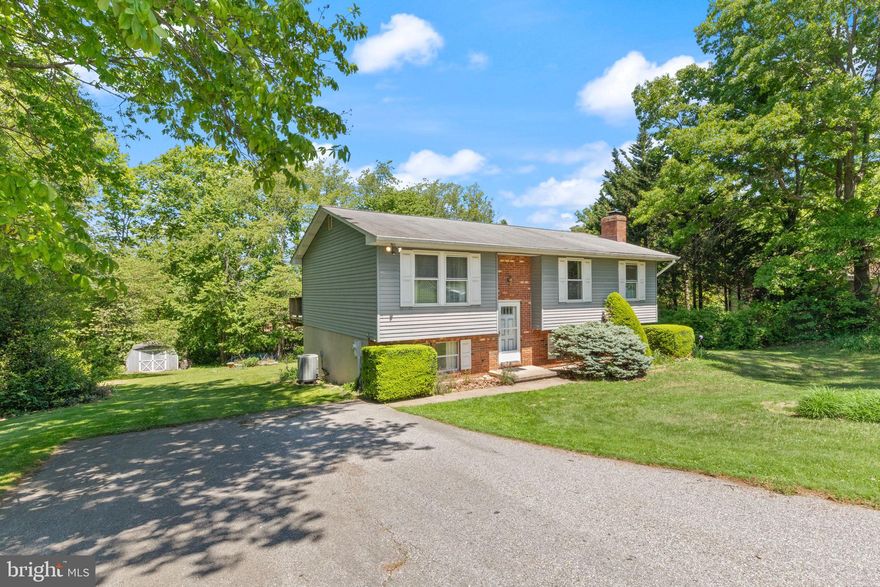 Welcome Home to this super charming and well cared for split foyer in a great location here in Westminster, MD! Exterior features include a lovely 1/2 acre lot lined with mature trees, great walking/biking neighborhood with spaced out homesites which means less cars coming through, wide driveway plus street parking, spacious deck overlooking the private rear yard, lovely garden beds and a large shed in the rear.  The interior of the home has some recently updated systems, 3 bedrooms and full bathroom upstairs plus a FULL BATH on the lower level... Speaking of the lower level - TONS of potential in the main room with high ceilings, woodburning stove, and fully insulated with ground level walkout slider - ready for new owner to finish the space! Unfinished side features laundry, utility sink, and plenty of storage or workshop area.  Such a charming home and an incredible value for the area.  Book your showing today!
