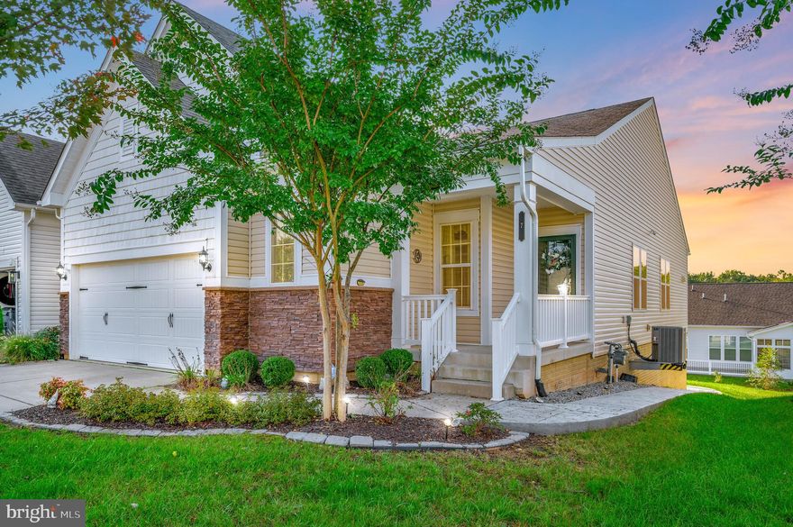 This home is made for entertaining!  This beautiful, well-maintained home offers an open floor plan main level area with a large primary bedroom with a finished walk in closet and en-suite bathroom with a soaking tub and separate shower. There is a generous sized secondary bedroom and home office that can also serve as a guest room.  The open living/dining room area leads to a gourmet kitchen with top-of-the-line stainless steel appliances that is made for a chef.  The kitchen has an island with beautiful pendants lights overhead. The finished walk out basement includes a large bedroom, full bathroom, a bonus room that could be a theater, exercise or hobby room.  The basement also includes a large storage room.  One of the most impressive aspects of this home are the two sunrooms, one on the main level off the kitchen and the second on the basement level. The main level sunroom is connected to a trek deck that can serve as your grilling area. The basement sunroom leads out to a beautiful stamped patio with a wrought iron fence.  You will love the oversized two car garage with an extension that comes with cabinetry.  The amenities in this gated community can’t be beat - 30,800 sq. ft. clubhouse with indoor/outdoor pools, fitness facility, indoor track, tennis, pickle ball and bocce courts, garden plots, and a full-time lifestyle director. This home and community provide everything you need!