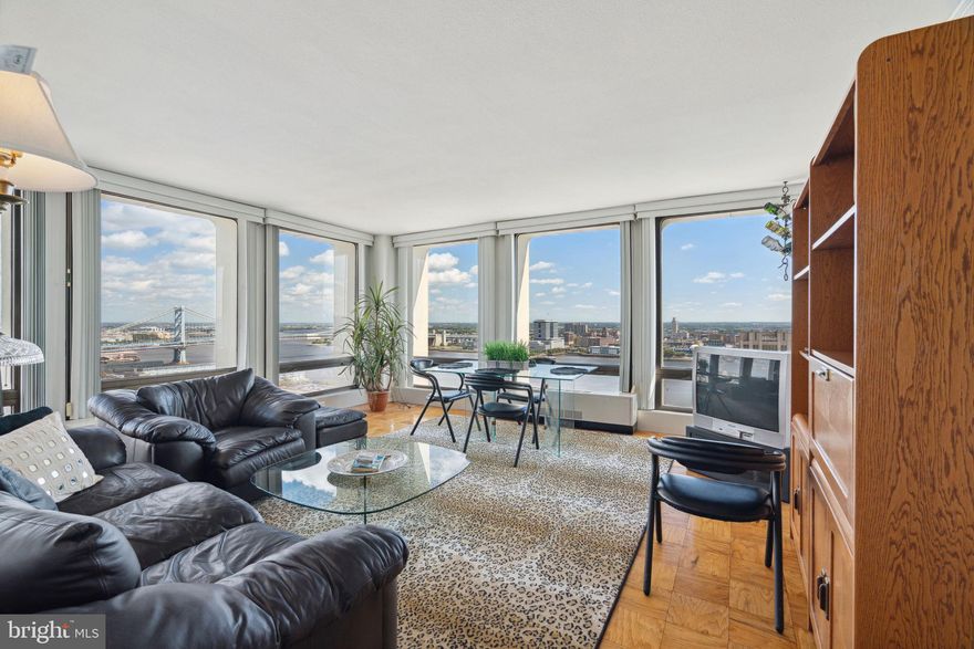 Well maintained one bedroom corner residence with breathtaking Delaware River views on a high floor of Society Hill Towers. Enter into the light-filled hall that leads to the spacious living/dining area with parquet wood floors and six oversized floor-to-ceiling windows that offer incredible natural light and stunning views of the river and Ben Franklin Bridge. The fully equipped galley kitchen features white cabinetry, tile backsplash, and a breakfast nook with another oversized window. Enjoy more spectacular light and views in the large bedroom that includes two massive windows, brand-new wood floors, and nice closet space. Full bathroom with tub shower and white tile floor. Additional highlights include crown and baseboard molding and excellent closet space throughout. Residents of Society Hill Towers enjoy a 24-hour doorman and all utilities plus basic cable. Access to the building's outdoor seasonal pool, fitness room, storage lockers, and parking in the building's underground garage are available for an additional fee. Also, there is an on-site Philly Car Share, a coin operated laundry room in the basement, and a shopping plaza on site with a market, dry cleaner, beauty salon, and one of Philly's most acclaimed restaurants, Zahav.
