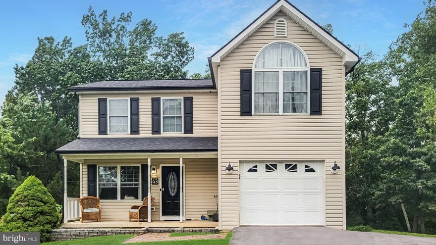 Welcome to this charming 3-bedroom, 3.5-bathroom home nestled in the peaceful Forest Heights neighborhood of Martinsburg, WV.  2,100 sq. ft. of living space on a 0.32-acre lot that backs to tranquil woods. You won't want to miss this!

Step inside to an inviting open floor plan on the main level, featuring a bright and airy living room, a formal dining area, and a spacious kitchen with Corian countertops, a pantry, and direct access to the garage. A door from the dining room leads to a large deck that overlooks the serene, wooded backyard—perfect for hosting gatherings or simply relaxing.

Upstairs you'll find three bedrooms including a sunny primary suite with a large bathroom. Laundry is right outside primary suite!
The fully finished basement provides flexibility as a recreation room or play area and includes a full bathroom and additional storage space.

Recent updates include a brand-new roof, gutters, shutters, HVAC system, refrigerator, and oven, all completed within the last year. The home also features a 1-car garage and a driveway with room for three additional vehicles.

Located in the sought-after Forest Heights neighborhood, this property offers a quiet, relaxing lifestyle. The location is ideal, with convenient access to I-81 and MARC commuter trains, making trips to Washington, D.C., and Baltimore a breeze. Enjoy the nearby attractions, including downtown Martinsburg's historic charm, outdoor adventures at Harpers Ferry, the Appalachian Trail, and local shopping and dining.

Move-in ready, this home is ready to welcome its next owners. Schedule your private tour today and make this beautiful property yours!