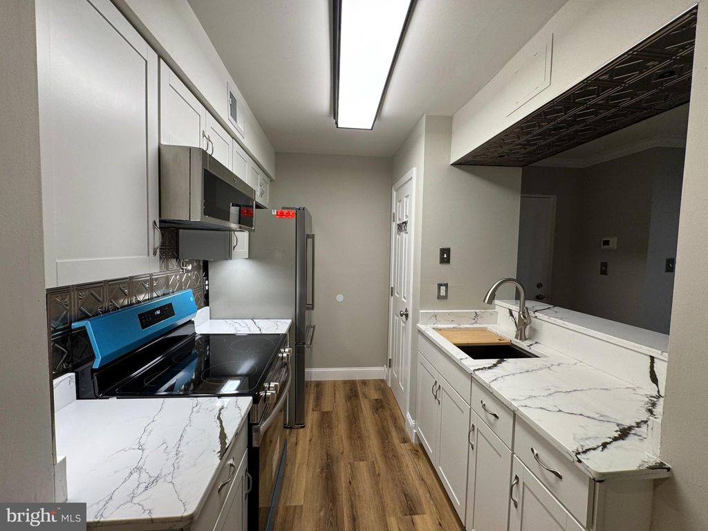 Photo of 5812 Royal Ridge Drive #C, SPRINGFIELD, VA 22152 (MLS # VAFX2293758)