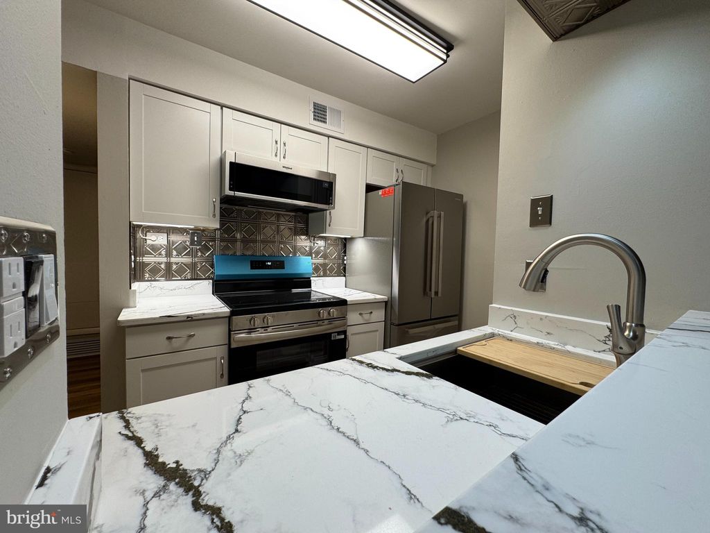 Photo of 5812 Royal Ridge Drive #C, SPRINGFIELD, VA 22152 (MLS # VAFX2293758)