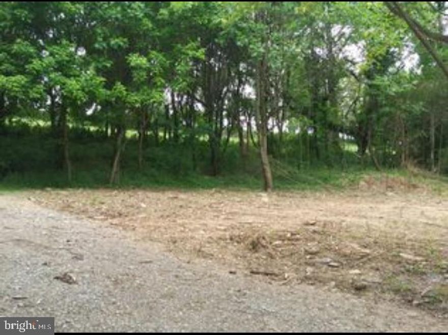 Want to get away?? Beautiful one acre private lot with existing septic and well. Build your dream home in your own private woods!