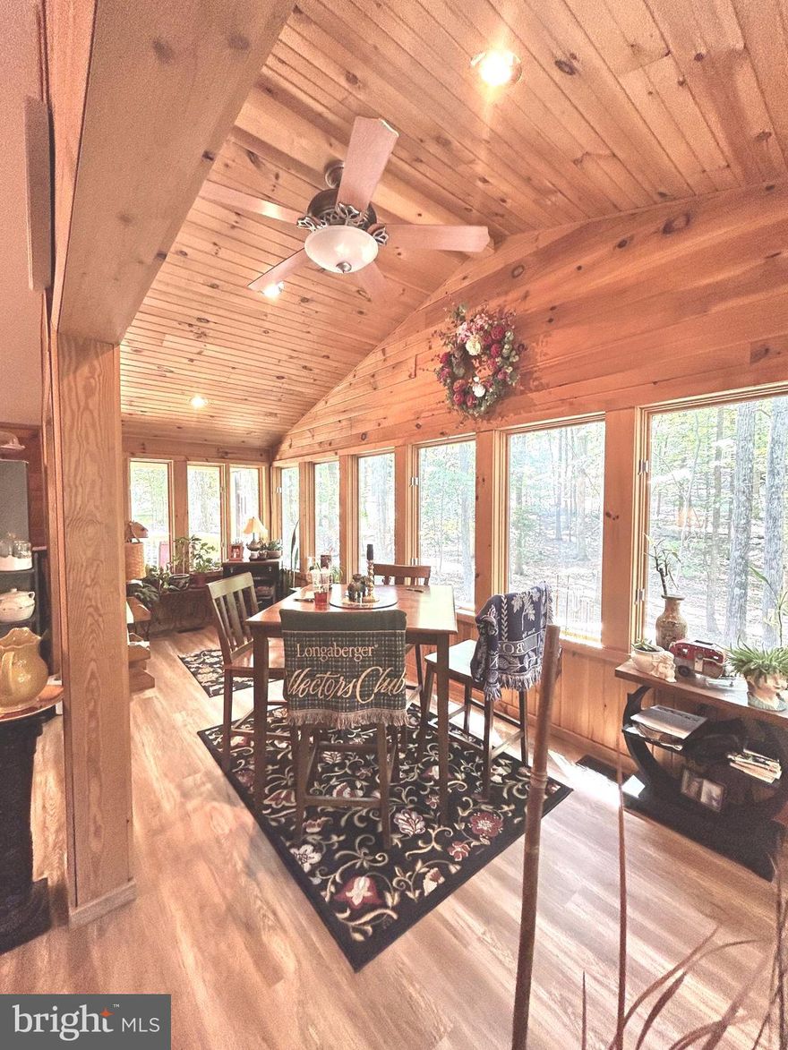 FULL TIME or PRIME INVESTMENT Your Choice! What I can tell you about this home is this; superior 360 degree views from every room. ROOF, HVAC, Electrical, Plumbing have all been routinely checked and maintained  over its years. The extensive wood work, beam ceilings and added space on the front deck give it that added space for entertainment or relaxing in your own private space in nature. New appliances meet todays needs and the added shed with electric and over ten tons of crushed gravel allows massive parking and even a full turn around with big trucks if needed. A MUST true to its photos and better in person!!! Start packing this seller is ready to move out so you can move in !