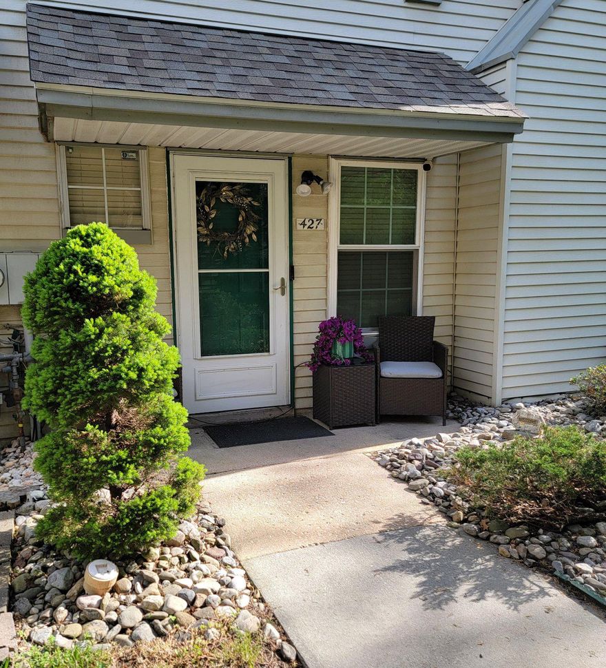 Welcome home to the sought-after Stonebridge community—where comfort, convenience, and charm come together effortlessly! This beautifully maintained, move-in ready end-unit townhome is full of natural light, stylish updates, and peaceful surroundings you’ll love coming home to. 

From the moment you arrive, the inviting walkway and curb appeal set the tone. Step inside to a bright, open living space featuring stylish lighting, sleek PVC (polyvinyl chloride) flooring, and a cozy wood-burning fireplace—perfect for relaxing nights or entertaining friends. Just beyond, the dining area is filled with sunlight and opens to your private patio, where you can unwind and enjoy serene, tree-lined views and open green space. 

The kitchen blends functionality and style with stainless steel appliances, maple cabinetry, and updated hardware—ready for everything from quick meals to hosting. A convenient first-floor powder room and laundry area add to the ease of living. 

Upstairs, you’ll find two spacious primary suites, each with its own private bathroom—ideal for guests, roommates, or simply spreading out. The third floor offers even more flexibility with a bright additional bedroom and generous storage, including a rare insulated walk-in attic with a secure door—perfect for keeping everything organized. 

Fresh paint, neutral carpeting, and thoughtful updates throughout make this home truly move-in ready. Plus, your assigned parking space is right out front, with plenty of guest parking available. 

Living in Stonebridge means enjoying a low-maintenance lifestyle—no mowing, no shoveling, just more time to enjoy what matters. Community amenities include scenic walking areas, parks, a pond, tennis courts, clubhouse with sauna, and a refreshing outdoor pool—all just steps from your door. 

Tucked away in a peaceful, wooded setting yet close to everything, you’ll love the easy access to shopping, dining, major routes, and local conveniences. Whether you're commuting, studying, or exploring, this location truly checks every box. If you’ve been waiting for the perfect blend of comfort, style, and convenience—this is it. Don’t miss your chance to make it yours...Make an offer TODAY!!!