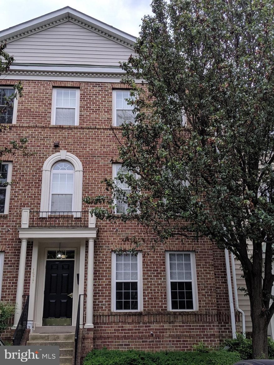 2 level luxury townhouse condo w/ many upgrades. Eat-in kitchen w/ 42" cabinets, tile floors, gas, granite counters, & under-mount sink/faucet. Kitchen opens to quiet balcony & green space. Open plan w/ high ceilings, living/dining room w/ crown molding & hardwood. Double sink MBA. Hardwood in MBR w/ crown molding & bay window on main floor. Cozy family room. Secondary bedroom downstairs has a sliding glass door for backyard access. Assigned Parking. Just blocks to Silver Line Metro.  Apply online:  https://apply.link/3h9O4rv