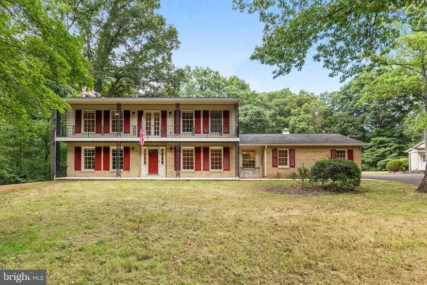 New Price!  Beautiful Sun Lit New Orleans Inspired Colonial. This property offers almost 2 acres of privacy, adorned with stunning mature trees. Step inside 4-bedroom Colonial, featuring an upper-level balcony that brings in abundant natural light through its numerous windows. The main level bedroom can easily be transformed into an office, providing flexibility for your needs.
The kitchen has been thoughtfully updated and connects seamlessly to a spacious screened porch with a porcelain tile floor and skylights, an idyllic spot for outdoor gatherings and relaxation.
Appreciate the large deck and lower and mid-level patios, perfect for enjoying the beautiful surroundings. An oversized garage attached to the kitchen includes an extra refrigerator and freezer, providing ample storage space.
Additionally, you'll find a detached 2-car garage with a portico, enhancing the curb appeal of the property. The finished WALKOUT basement features charming wood beams and new plank flooring, adding character to the space. Great opportunity with ample room in the back for a Pool, Sport Court, Pickle ball/Tennis court
Don't miss this unique opportunity to own your dream home, conveniently located just minutes from the toll road,  short drive from downtown Vienna, Tysons Corner, Reston Town center, Wolf Trap Preforming Arts Center and local commuter routes.. Embrace the potential and create your dream sanctuary amidst the beauty of this generous lot with mature trees. Note: Gas Line is available for hook up in front of the home.