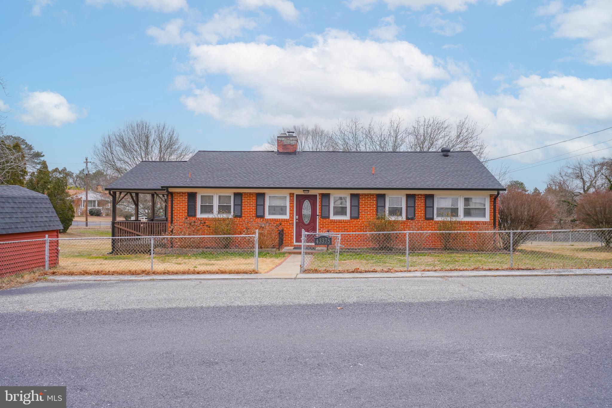 Discover the charm of this brick rambler in desirable Hollywood, MD! Featuring 3 bedrooms and 1.5 baths. Relax in the cozy living room with a wood-burning fireplace. This home is located on a spacious corner lot with a fully fenced yard, offering both privacy and convenience. Enjoy outdoor living on the wraparound deck and plenty of storage with a 1-car garage and storage shed. Move-in ready and just minutes from local amenities—don’t miss this opportunity!