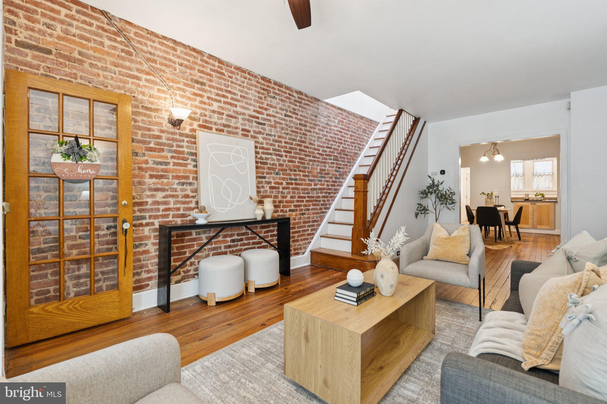 Welcome to Patterson Park! 40 S Decker is ready to move in. All of the charm and character of Baltimore City in this 3 bed, 2 bath row home. Walk into hardwood floors and exposed brick walls, with tons of natural light. Space to entertain and dine in the front of the home with kitchen and rear patio access in the back. Enjoy the back yard patio or open it up for additional parking. Upstairs the hardwood floors lead you to 2 bedrooms and 1 full bath with a "multi purpose area", or use the space to add another bathroom and closet space. The lower level has a room that can be used as a bedroom, tv room, exercise room, a whatever room! Built in bar, and a full bathroom with storage space round out the rest of the home. Conveniently close to ALDI for grocery runs, Two Rivers Park for outdoor recreation, and quality educational options nearby. Public transportation access makes commuting a snap. This property combines the warmth of an established neighborhood with thoroughly modern amenities. Whether you're scaling up, or looking for your forever home, this townhouse offers the perfect blend of comfort, convenience, and contemporary living in one of Baltimore's most desirable areas. Located just minutes from downtown, John Hopkins Hospital, and an array of restaurants, this home offers the best city living with a cozy retreat. Welcome & Enjoy!
