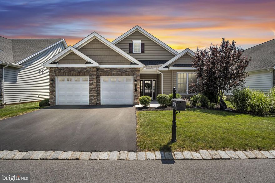 Elegant Single-Story Home in Traditions of America at Silver Spring
Discover exceptional style and comfort in this beautifully upgraded 3-bedroom home, perfectly situated in the sought-after 55+ community of Traditions of America at Silver Spring. Designed for effortless single-level living, this residence blends luxury finishes with thoughtful upgrades inside and out.
The gourmet kitchen is a chef’s dream, featuring a fully upgraded design with a 5-burner gas cooktop, stainless steel GE Profile and Café appliances, a separate walk-in pantry room, and designer lighting. Luxury vinyl plank and tile flooring flow seamlessly throughout the home, complemented by custom paint and upgraded fixtures.
A cozy gas fireplace and home theater features anchor the inviting great room, while the converted three-season porch offers year-round enjoyment of the tranquil, private backdrop with mature trees. The extended garage, with an additional 5 feet of depth, provides ample space for storage or hobbies. Upgraded epoxy surfaces on the front sidewalk and entryway add durability and curb appeal.
Enjoy the active, low-maintenance lifestyle of this award-winning community, with resort-style amenities, walking trails, and a welcoming neighborhood atmosphere—all while savoring the peace and privacy of your own retreat.