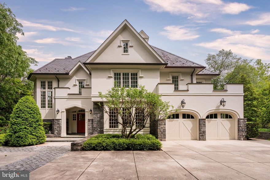 Set on a rare double lot just minutes from Washington Golf & Country Club, this exceptional estate designed by Glenn Fong and built by TJO Homes offers a level of privacy, scale, and craftsmanship seldom found in North Arlington. Encompassing approximately .92 acres across two parcels, the property unfolds as a true legacy residence—designed for both grand entertaining and effortless daily living. 

A stately façade of hardcoat stucco and stone introduces interiors defined by timeless architecture and refined detail. Inside, soaring ceilings, extensive custom millwork, and sun-filled spaces create an atmosphere of quiet sophistication. The home offers 6 bedrooms, 6 full baths, and 3 half baths, along with 7 fireplaces thoughtfully placed throughout to create warmth and ambiance.  

Designed for modern living, the residence features an elevator servicing all three levels, dual staircases, and seamless indoor-outdoor flow. The chef’s kitchen is appointed with Sub-Zero and KitchenAid appliances, custom cabinetry, and an oversized island, opening to a gracious great room with beamed ceilings and French doors leading to an expansive flagstone terrace—ideal for al fresco dining and entertaining. Just off the kitchen, a cozy and comfortable keeping room (den) with its own wet bar provides an inviting space for relaxed evenings or intimate gatherings.  An fully equipped mudroom with multiple closets, half bathroom, and access to the oversized 2-car garage keeps daily life organized and tidy.

The upper level is anchored by a magnificent primary suite with a gas fireplace, a large private sitting room which doubles as a bedroom, two full bathrooms with refined finishes and materials, and two large custom walk-in closets. A finished attic with walk-up access is ideal for seasonal storage. Each additional bedroom offers ensuite accommodations while a laundry room conveniently services this floor. 

The lower level is equally impressive, with high ceilings, a recreation room with full bar, fitness space, guest suite or private office with fireplace, 2nd large laundry room, and an oversized finished storage room—creating a private retreat for work, relaxation, fitness, or hosting.  

Outdoors, the grounds evoke a private estate setting rarely available this close to Washington, DC. The nearly one-acre combined site includes sweeping lawn areas, mature landscaping, and multiple entertaining terraces, all connected by a thoughtfully designed drive and garden paths.  

Located moments from Chain Bridge, Georgetown, and the region’s top schools, this residence offers a seamless balance of accessibility and retreat. Built in 2009 by Galileo—renowned for uncompromising quality and enduring design—this is a home that speaks to those who value craftsmanship, discretion, and a sense of arrival. 

A truly distinguished offering in one of Arlington’s most coveted enclaves. 4190 Little Falls Road (0.46-acre) is being sold in conjunction with the adjacent lot (0.46-acre).