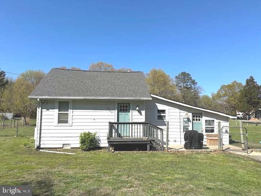 Very rare to find an adorable little cottage located on approximately 2 acres. Newer roof, windows & doors. This one has 2 beds, 1 bath, a bright open sunroom thats perfect for a family / living room, a cute little kitchen & dining room.  Full size stackable washer/dryer.  Newer two zone ductless mini-split.  This beauty sits on almost two acres of flat & open land backing to woods.  There is a nice new shed as well as part of the rear yard being fenced in.  It's one of the largest / flattest lots in Shady Side, so don't miss seeing this amazing location.  The home has been well cared for, but being sold AS-IS.  No covenants or restrictions, plenty of parking for your boat or RV.   Walk to Shady Side Elementary school, restaurant, grocery store & local marina. Home was just hooked to public sewer. 50 minutes to D.C, 30 minutes to Annapolis. Why pay rent when you can own for less or if you are looking for that perfect lot in a quiet community close to the water to turn into your dream home oasis...  You've found it.  This one will not last long, so make sure to see it as soon as you can.