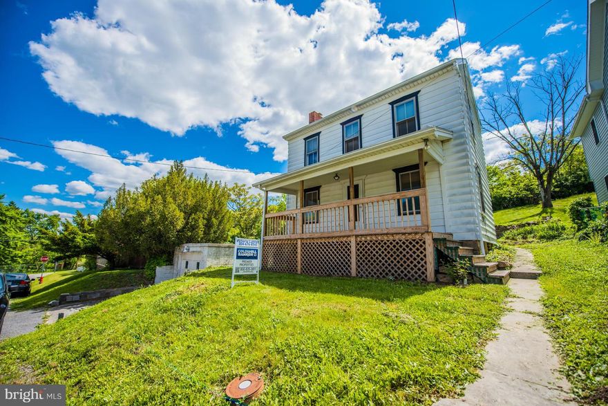 This charming home sits on city lot with public water and sewer and has nice yard area. Nice front porch to enjoy the views of Historic Berkeley Springs. This home has wood floors and is clean and dry. Has gas fireplace in the living room and wood stove in the basement..Enclosed back porch . This could be full time home, second home or investment property. Property is sold as is.