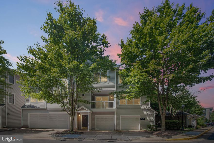 ALL NEW FLOORS, FRESHLY PAINTED, 3 bedroom 2 full bath condo/townhome with one car attached garage.  The main level is open and bright with gorgeous tree views.  There is a dining room, family room with gas FP, lovely gourmet kitchen with Stainless Steel appliances, granite and large island for extra seating, a laundry room and a private balcony with room for seating.  Upstairs, there are 3 bedrooms and 2 full baths.  The master bedroom has a large walk in closet and an en suite bathroom with freshly painted cabinets.  The other 2 bedrooms are large with a hall bath to share.  There is a one car garage that has been freshly painted with room for storage, and a driveway for parking for an extra car.  AC was replaced in 2016. Gated community with pool, fitness center, BBQ areas and Shuttle to the Vienna Metro. Walking distance to  shopping and dining.