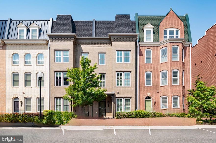 In the heart of Potomac Yard, just a couple of blocks from the new Potomac Yard metro station, this stunning four-level townhome offers four bedrooms, four full baths, and one half bath. This home boasts high-end updates throughout.
The property includes an amazing detached two-car garage with electric car outlet and a guest house above with separate entrance, featuring a full bath and kitchenette, ideal for an in-law or au-pair suite. 

Enter the light-filled main level, which features an open floor plan with high ceilings, new large format tile flooring, a gas fireplace, designer wallpaper, crown moulding and custom lighting. The gourmet kitchen is equipped with extensive custom cabinetry and storage, a breakfast bar, and a separate bar area. The backyard oasis is updated with no-maintenance astroturf, patio pavers, and beautiful landscaping, perfect for entertaining.

Upstairs in the main residence, the full primary floor offers a luxurious ensuite bath, dual closets with custom organizers, and a private home office. The next level features a large media room (which could be converted to a fifth bedroom), two additional spacious bedrooms, a full bath, and side-by-side updated laundry. The home is crowned by a second entertaining floor with custom cabinetry, an added beverage fridge and backsplash, and a full bathroom. A wall of new glass doors opens to a perfect sunset roof terrace with designer parquet flooring and expansive views.

This perfect location is close to the metro, Del Ray, Old Town, and Potomac Yard shopping, and just minutes from DC, the Pentagon, and the Amazon Campus. Assumable VA Loan