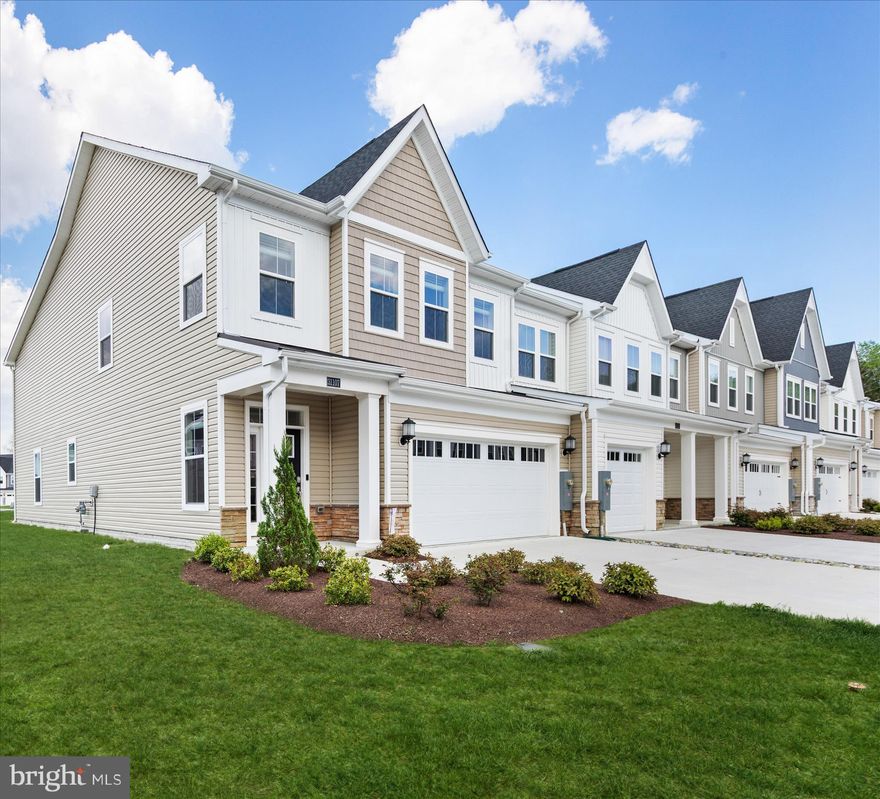 A must see!  Welcome to 31107 Christies Way, a beautifully appointed end-unit townhome in the highly desirable community of Milo’s Haven.  Built in 2024 and set on a premium corner lot, this exceptional residence offers attractive curb appeal with thoughtfully landscaped grounds, a covered entry, and an inviting transom door with a sidelight panel.

From the moment you step inside, you are greeted by a light and airy interior featuring a soft white palette, 9 ft.+ ceilings, crown molding and upgraded, luxury vinyl plank flooring that flows seamlessly through the main living areas.

The open-concept floor plan showcases a gorgeous gourmet kitchen that will impress any home chef. Package upgrades include quartz countertops, crisp white trim-topped cabinetry, soft-close features, and a suite of like-new stainless-steel appliances create a polished and functional space. A five-burner gas cooktop, double wall ovens, classic subway tile backsplash, pull-out drawers, and a spacious island with additional seating make this kitchen the true heart of the home. The adjoining living room features vaulted ceilings and double sliding glass doors that open to a screened porch and paver patio, offering the perfect setting for indoor-outdoor living and entertaining.

This thoughtfully designed home includes four bedrooms, highlighted by two spacious primary suites, including one conveniently located on the main level. The main-level primary retreat features a tray ceiling, walk-in closet, and a beautifully finished ensuite bath complete with tile flooring, dual sink vanity, frameless shower with dual showerheads and bench seating, and a private water closet. The main level also includes a convenient powder room and a laundry room with direct access to the fully finished, drywalled, 2- car garage.

Upstairs, an oversized loft provides a versatile gathering space and serves as the hub for three additional bedrooms, all with walk-in closets and neutral carpeting. A second primary suite with a private ensuite bath, along with two additional bedrooms serviced by a hall bath, ensures ample space for family and guests. 

Milo’s Haven offers a welcoming community atmosphere with low-maintenance living, making it ideal for both full-time residents and those seeking a coastal retreat.  Amenities include a swimming pool and walking trails, all while being conveniently located near beaches, restaurants, shopping and golf.  Whether you are looking for a primary residence, vacation getaway or coastal investment, this nearly new home blends modern design, coastal charm, and an unbeatable location, offering an exceptional opportunity to enjoy the very best of Delaware beach living!