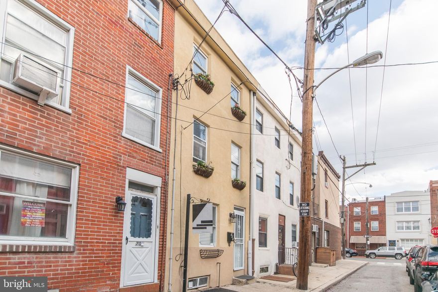 Nestled on a small street with quick access to everything, this three story trinity style home is just what you have been waiting for. Located in one of the hottest neighborhoods in the city, Passyunk Square. The first floor of the home features new flooring, an open modern kitchen with stainless appliances and access to the fenced in rear patio. On the second floor, you'll find a renovated bathroom with tub/shower and the smaller of the two bedrooms. The top floor of the home has updated flooring and a large bedroom space with two nice sized windows. Central air conditioning, hardwood flooring, outdoor space and an updated kitchen make this house a no brainer! The basement houses all of the mechanicals, washer and dryer and room for storage. Located just blocks from shopping, restaurants and quick access to Center City.