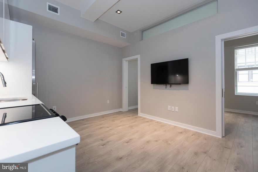 Beautifully renovated, luxury one bedroom with designer finishes at The Wilson! One bedroom in The Wilson, a boutique apartment building on the corner of 16th and Sansom Streets in the heart of Center City.  This home features an open kitchen with custom countertops and backsplash, stainless steel appliances, and modern cabinetry. The bathroom is appointed in custom finishes and has a modern vanity, large walk-in shower, and separate dressing area. Additional highlights include a flat-panel wall-mounted TV, washer/dryer, excellent closet space, oversized windows and wood-style plank tile floors. The building is wired for Comcast and residents pay electric, gas, water, and cable and Internet. Residents enjoy a central location less than 3 blocks from Rittenhouse Square, 2 blocks to the Market Street west office corridor, 2 blocks to The Avenue of the Arts, 1 block to Rittenhouse Row shopping and dining, and a plethora of restaurants and shops within close walking distance.