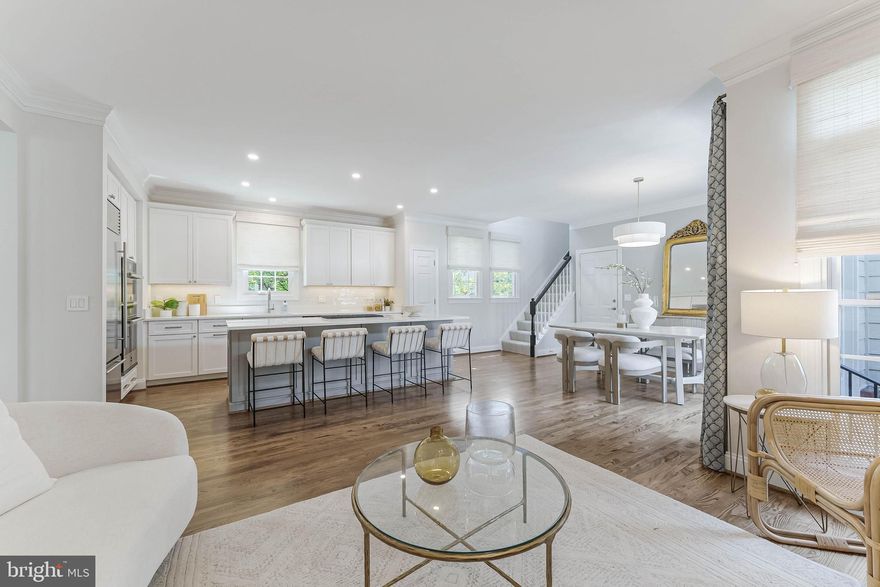 A fantastic offering in the heart of Downtown McLean—this turnkey brick Colonial exudes timeless elegance and unexpected scale. Encompassing approximately 3,650 square feet with  9’ ceilings on the main level and a 10’ vaulted ceiling guest suite, the home is well-appointed with designer finishes and a charming Georgetown style patio, two car garage and yard.

Step inside to an airy, open floor plan that seamlessly blends classic architectural elements with sophisticated modern renovations, including a stunning 2023 kitchen, 2023 primary bath, 2025 powder room, new carpet, and a custom stair runner leading to the guest suite with 10-foot vaulted ceiling. Natural light pours into every corner and designer window treatments accent walls of windows.

The kitchen is a showpiece, renovated in 2023 with modern shaker-style cabinetry with soft-close hardware, top-tier appliances, and refined finishes. The primary suite is a serene retreat, complete with 9’ tray ceiling and a 2023 spa-inspired bath with standalone tub, large shower and dual vanities. 

The fully finished lower level features an expansive recreation room, storage room, a den or office with closet, and full guest bath. A new roof was installed in 2021, further enhancing the home’s turnkey appeal.
Offering a wonderful balance of sophistication and warmth, 1448 Ingleside invites you to experience Downtown McLean living at its finest, with unmatched proximity to Greenberry’s, the McLean Racket Club, Starbucks, Grocery, Restaurants and more. Schedule your private tour today and prepare to fall in love.