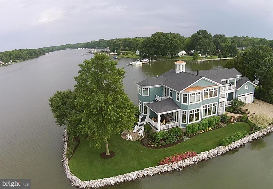 Stunning home, on a one-of-a-kind lot, w/ 270 degree water views! Custom built in '06 w/ meticulous attention to detail inside & out. It features an open floor plan w/ 13' ceilings, gourmet kitchen & huge master w/ oversized closets & super bath, HW floors,premium wood trim & crown molding throughout. IPEdecks & protected deep water pier, w/10K lift. Just 23 mi to DC beltway &15 mi to Annapolis.