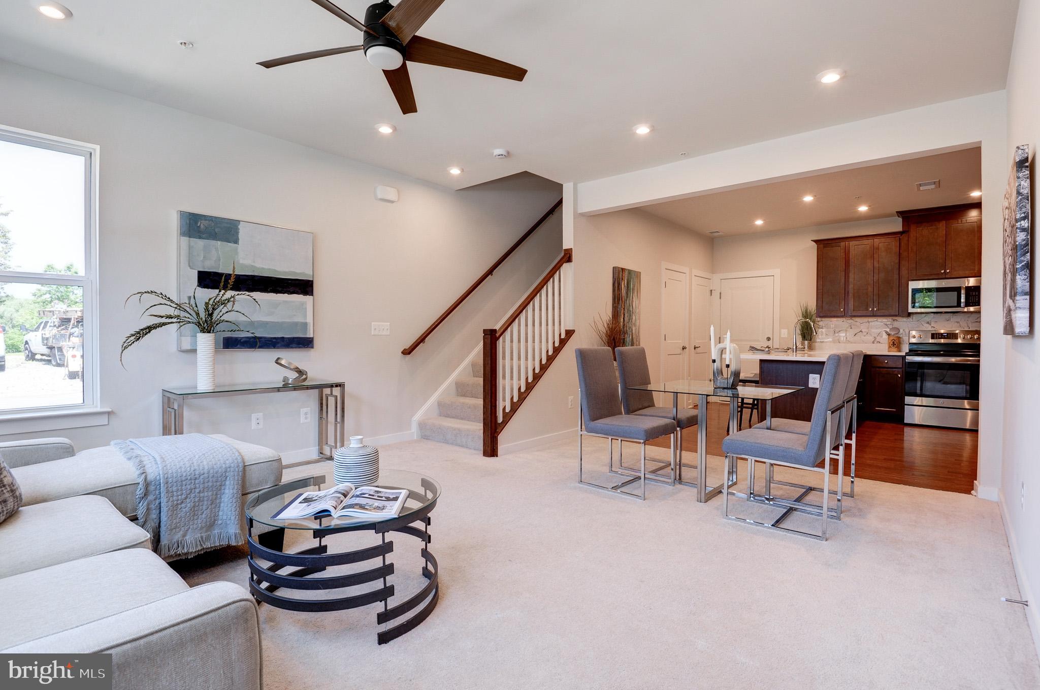 One year young home! END CORNER, LOWER 2 levels (First & Second level), stacked, townhome style CONDO at Ashburn Station Sub-Division! An exceptional location! Interior finished 1668 sq ft equipped w/2 bedrms, upper family_loft, 2 full baths, & 1 half bath; 72 sq ft balcony & 1 rear car garage w/opener + 1 driveway parking. Ample guest parking spaces available at the sub-division streets <br> <br> The best choice for townhome style condo within walking distance of Ashburn Metro, shops, dining, & entertainment | Perfectly situated within 1 mile of the Silver Line’s Ashburn Metro Station, Dulles International Airport, the region’s very best access to major employers, & everyday conveniences | Just minutes away to SHOPPES @ RYAN PARK, LOUDOUN STATION, & BROADLANDS MARKETPLACE/SOUTHERN WALK PLAZA that feature over a dozen restaurants, boutiques, & neighborhood services | Wide tree-lined sidewalks provide a peaceful way to explore the area, whether getting steps in or walking the dog | Access to major commuter routes like Loudoun County Pkwy, 267 Greenway/Toll, Ashburn Village Blvd & Waxpool Rd <br> <br> Water, sewer, lawn mowing, & mulching is included in HOA/Condo fee <br> <br> STANLEY MARTIN Homes built, TESSA floorplan, an open layout that allows light to flow through the entire area, an appealing sophisticated, modern design where comfort & convenience merge seamlessly; designed to be both practical & stylish <br> <br> Ample recessed lights thru out | Celing fans w/remotes | Ceiling fan pre wires <br> <br> The first floor opens to the family room, cozy eating area, & a humongous kitchen w/tile backsplash, quartz counters, & a long breakfast island. A pantry, coat closet, powder rm, & an acess to the garage off of the kitchen complete the first level | Second level is equipped with truly luxurious owner's suite featuring a spacious bathrm w/double bowl vanity, walk-in-shower, & a private water closet. Two large walk-in closets for plenty of storage space. Generous upper family_loft. A secondary bedrm that share a hall bath, a stacked washer & dryer, an acess to the balcony, & the mechanical area complete the bedrm level <br> <br> Amenities for year-round entertainment are available onsite: Current & soon-to-come amenities for meeting up w/neighbors, friends, & family; access to bocce court, playgrounds, an outdoor fitness area, firepit, gas grills, outdoor seating at several locations, as well as a bus stop serving Ashburn Metro Station every 10 minutes during weekday rush <br> <br> Numerous options for groceries: Harris Teeter, Lotte , Giant, & more....independent groceries | Pharmacies: CVS & Walgreens | Home Depot, nearby Parks, Lifetime Fitness, the W&OD trail, One Loudoun’s Top Golf, 1757 Golf Club & more <br> <br> Excellence in style, function & location