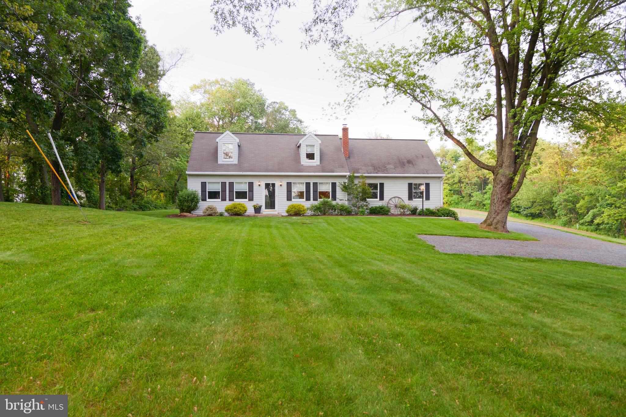 This property will be offered at Public Auction on Thursday, August 7, 2025 @ 6pm. The listing price is the opening bid only and in no way reflects the final sale price. 10% down due at auction, 2% transfer tax to be paid by the purchaser, real estate taxes prorated. This beautiful Cape Cod home is nestled on over an acre and surrounded by scenic Lancaster County farmland. The first floor features an inviting living room, an open kitchen & dining area with access to the covered back porch, as well as the primary bedroom, a full bathroom, and a dedicated laundry area. Upstairs, you will find two additional bedrooms and a full bathroom. The finished basement hosts a cozy family room, an office space with built in bookcases, and a storage area. Outside, enjoy the private backyard with mature trees, thoughtful landscaping, and a covered porch—perfect for relaxing or entertaining friends and family. Additional highlights include an attached two-car garage and convenient access to the Susquehanna River, local parks, and major routes including 222 and 30. This well maintained home is move in ready and full of charm - ready to welcome your family!