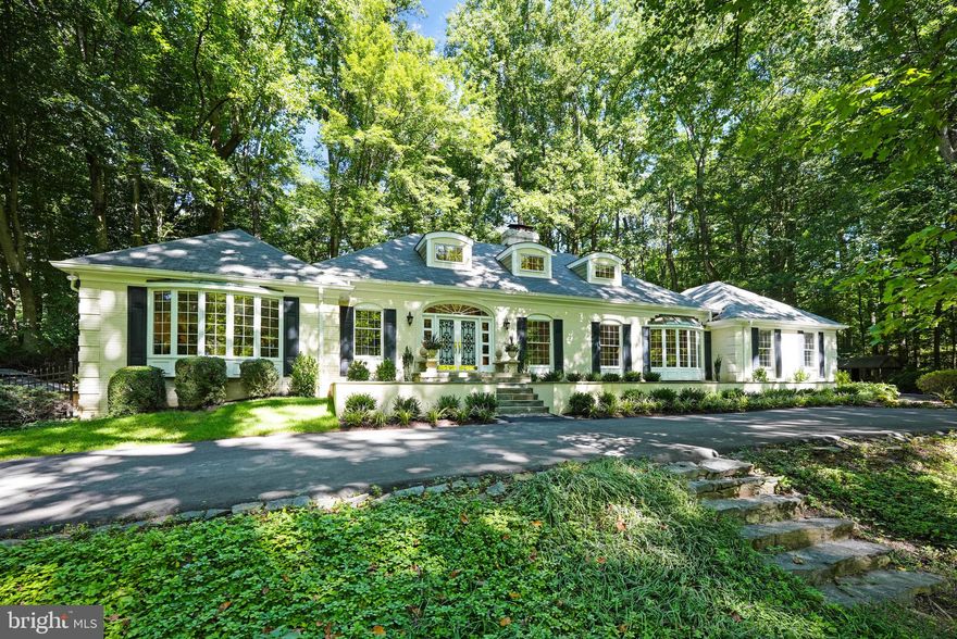 Welcome to 1042 Brook Valley Lane.  An Exquisite French Provincial Home on 3.33 Acres of Tranquil  Beauty. Custom Designed & Newly Updated: 4 Bedrooms ,4.5 Baths Including a Main Level Primary Bedroom Suite.

As you arrive, the newly paved, circular drive welcomes you to a property with timeless allure and a picturesque setting. Unwind amidst the captivating surroundings, complete with a beautiful spring-fed pond teeming with an abundance of fish, creating a serene atmosphere that will enchant any nature lover. Delight in the private patios, an inviting in-ground spa, and a cascading waterfall that sets the stage for relaxation and outdoor entertainment. A true oasis, featuring hundreds of flowering azaleas and tulip poplars, that further enhance its allure.
Step inside this remarkable home and be greeted by a showcase of recent upgrades and impeccable craftsmanship. Custom millwork and a marble foyer exude sophistication, while the first-floor primary bedroom suite encompasses three interconnected rooms, offering a haven of tranquility and privacy. Enjoy the large family room with a stone fireplace, built-ins and captivating views of the rear patio and waterfall. Designed for entertaining, this three-level home, offers an array of indoor and outdoor party areas, ensuring that every celebration is unforgettable. The newly renovated gourmet kitchen and breakfast room showcases top-of-the-line appliances, making it a culinary enthusiast's dream. The living room, with its lofty 9 ft ceiling, fireplace and spacious gallery walls, provides an ideal backdrop for displaying artwork and creating an ambiance of sophistication. The large office with built-ins caters to the needs of today's work-from-home lifestyle, while four bedrooms and four and a half baths offer ample space for comfort and privacy. 
The upper level offers two generous bedrooms that walk out to a balcony and two renovated
baths. There are walk-in closets and generous storage in walk-in Attic spaces.

The finished, walk-out, lower level offers a bright and sunny bedroom/office ,a remodeled
bathroom next to a relaxing sauna, and a recreation room, currently being used as a gym. The
side walk-out access leads to the private patio with the in-ground, heated Spa with waterfalls.
The utility room offers storage and a workshop area for pursuing hobbies and creative endeavors.
Tucked away on a quiet, no- through street, this exquisite property is conveniently located to Tysons
Corner, providing an enviable blend of serenity and urban convenience.