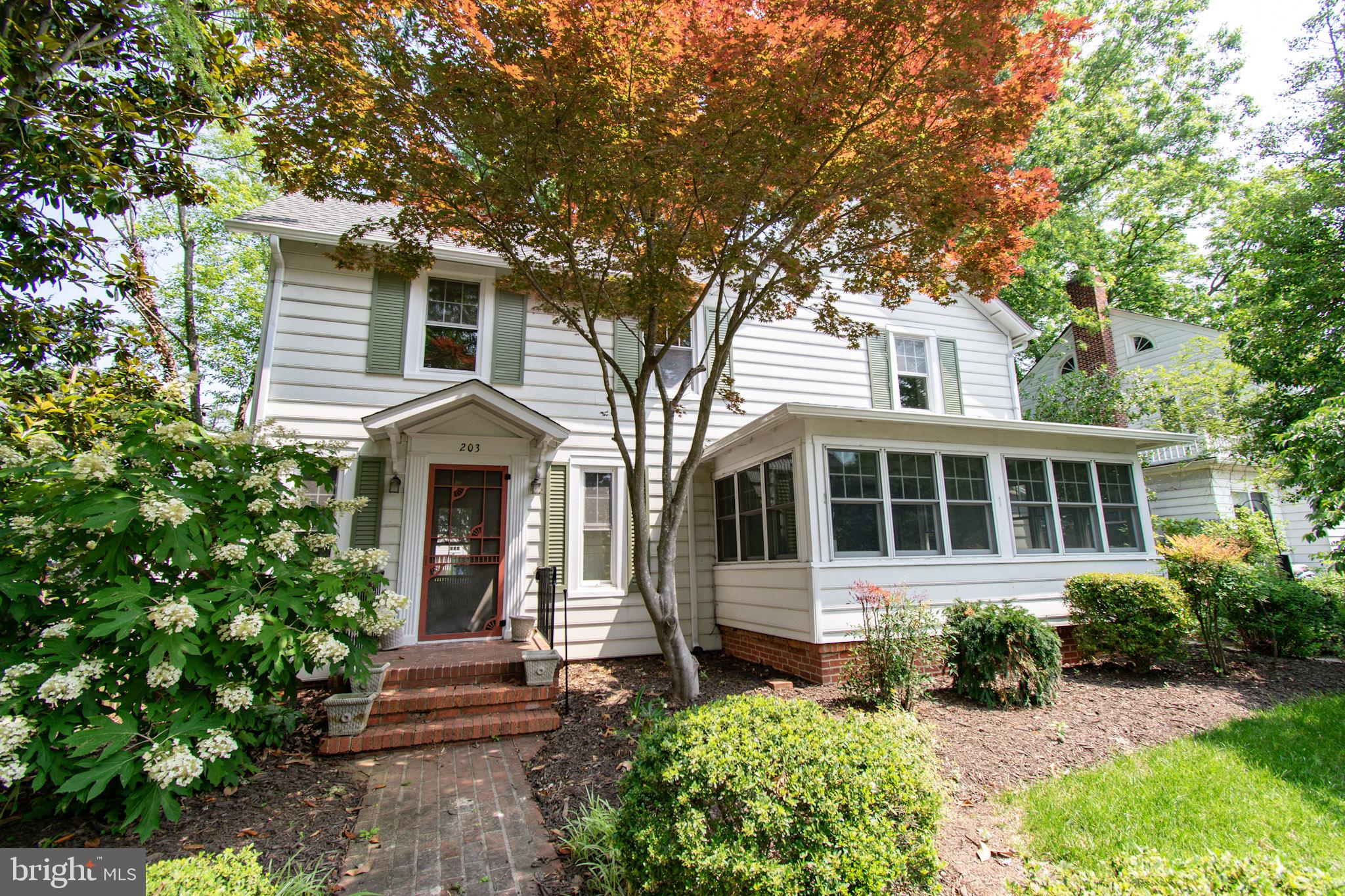This charming 1910 historic home offers timeless character and incredible potential. Lovely hardwood floors run throughout, with standout features like a spacious sunroom with brick flooring and a cozy family room with built-in shelves and cabinets. The main level includes a living room, family room, sunroom, country kitchen, laundry area, and powder room. The kitchen opens to a generously sized backyard with alley access and flagstone patio beneath a mature shade tree. Upstairs, you’ll find a primary bedroom with dual closets, two additional bedrooms, two full baths, and a hallway linen closet. While the home could benefit from updates, it’s a solid opportunity to make this classic property your own.