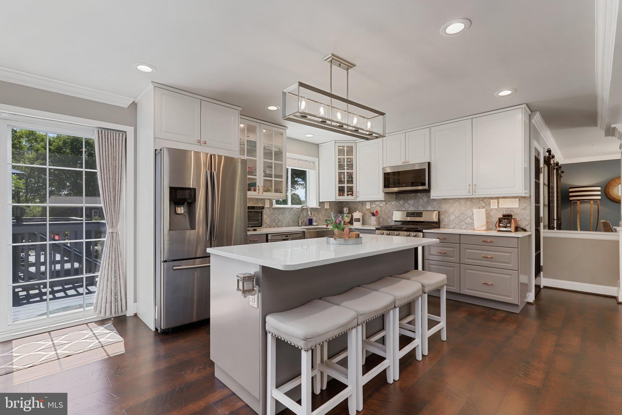 Must see inside! This home has undergone a complete renovation and is ready for you to relax and enjoy! It begins with an eat-in kitchen featuring white quartz countertops, all new appliances, two-tone cabinetry and a farmhouse mounted sink with touch enabled faucet. The upper level also holds three bedrooms and two full bathrooms. An expansive deck with storage area underneath opens off of the kitchen onto an uncommonly large and beautiful backyard with an extended driveway to accommodate multiple vehicles and/or a boat (with EV charging capability). A large pergola also decorates the backyard and provides shade for a built-in grill. The fully finished lower level hosts a large bedroom, a full bathroom and a large, open flex space perfect for kids, exercise or entertaining. The lower level is pre-wired for a projector.
Renovations in 2018 include the kitchen, bedrooms, bathrooms, HVAC ducts, water heater, sewer pipes, water pipes, flooring, finished basement, washer/dryer and more. The roof was redone in 2019. In that same year the owner’s added backyard pavers, an extended driveway, deck, pergola, grill, fence and landscaping. Pull down attic access with added insulation. Brand new from top to bottom!
The home is just one block to Washington Country Club and .7 miles to Jamestown Elementary School. This home is located in the Jamestown/Williamsburg/Yorktown school pyramid. The neighborhood is centrally located and close to the chic and trendy Ballston Quarter, downtown McLean, C&O trails and to Chain Bridge for easy commuting to DC.