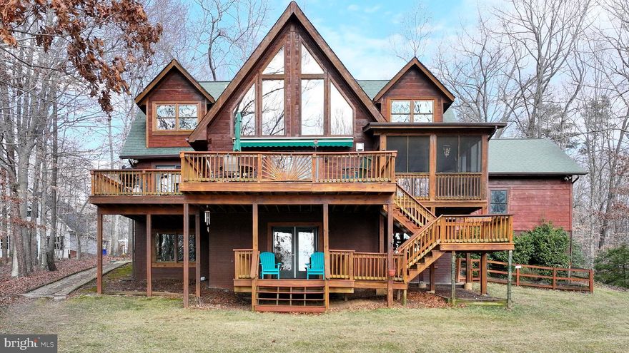 Welcome to your dream-come-true waterfront log home. This lovely 5 bdrm/3.5 ba custom home (3 bdrm septic) offers the prefect location (by land and water) with great views of the lake and the comfort and warmth of natural wood throughout. You'll see the lake immediately upon entry into the foyer and family room featuring 2-story windows, a corner stone hearthed wood stove, and a loft. Enjoy your morning coffee or evening drink on the attached screened porch or stroll along the concrete path to the screened porch on the dock where evening sunsets can be enjoyed. The main level primary bedroom overlooks the lake and includes a walk-in closet and en-suite. The gourmet kitchen offers a 5-burner gas cooktop and wall oven with convection microwave. Outdoor dining and lake enjoyment are ensured! This home features two over-sized bedrooms on the upper level with full hall bath. On the lower lake level, a generous sized family room offers the perfect hangout spot for family fun. Fourth and fifth bedrooms create lots of over-sized bonus space and can easily transition to the perfect opportunity for an office, game room or other options. This home also includes a 2-car attached garage and a free-standing storage shed.  A built-in humidifier system for the main HVAC unit and in-ground irrigation system are some of the many special features! PROFESSIONAL PICTURES TO BE POSTED AS OF MARCH 1, 2026.